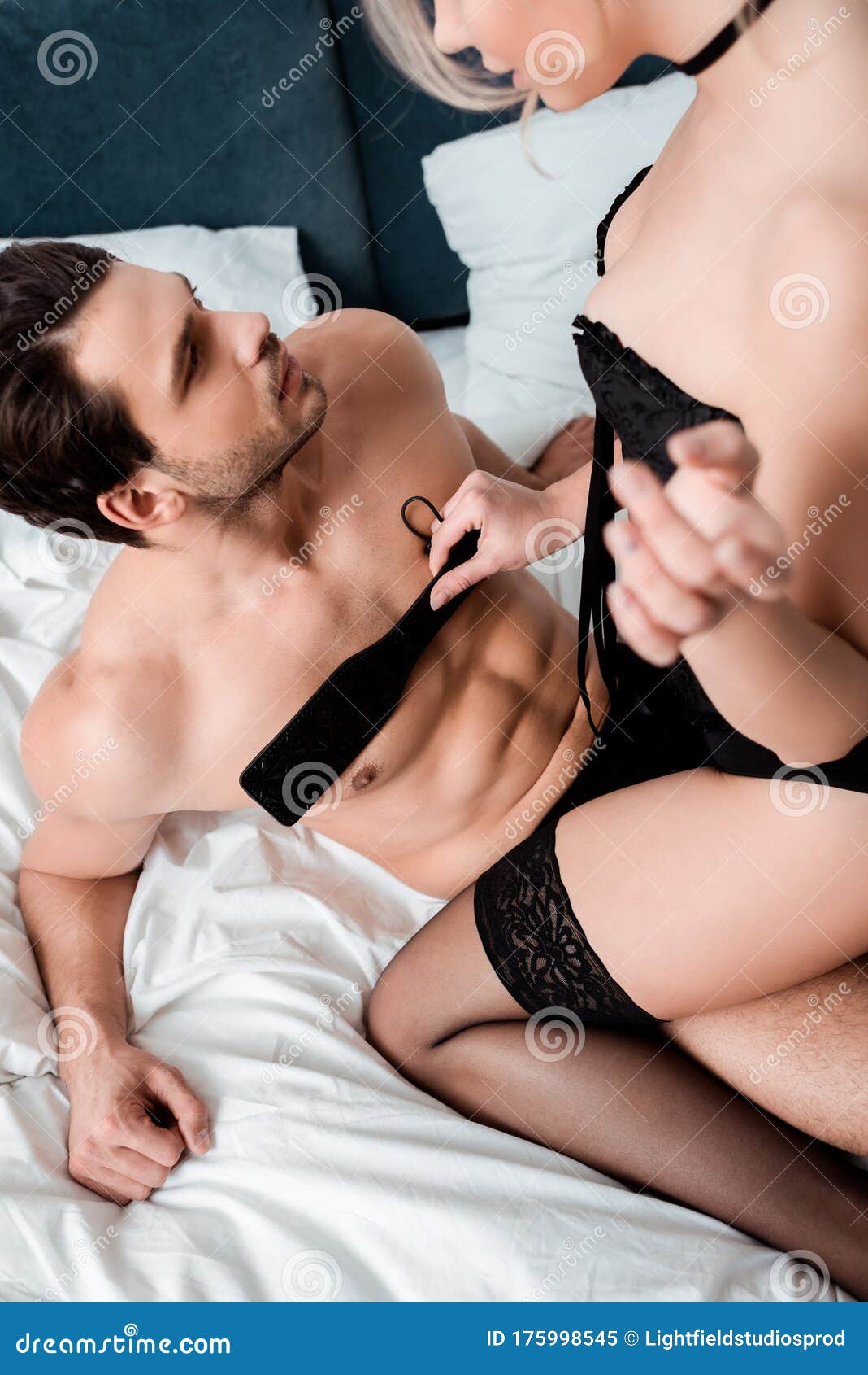 Woman Holding Spanking Paddle and Sitting Stock Image image