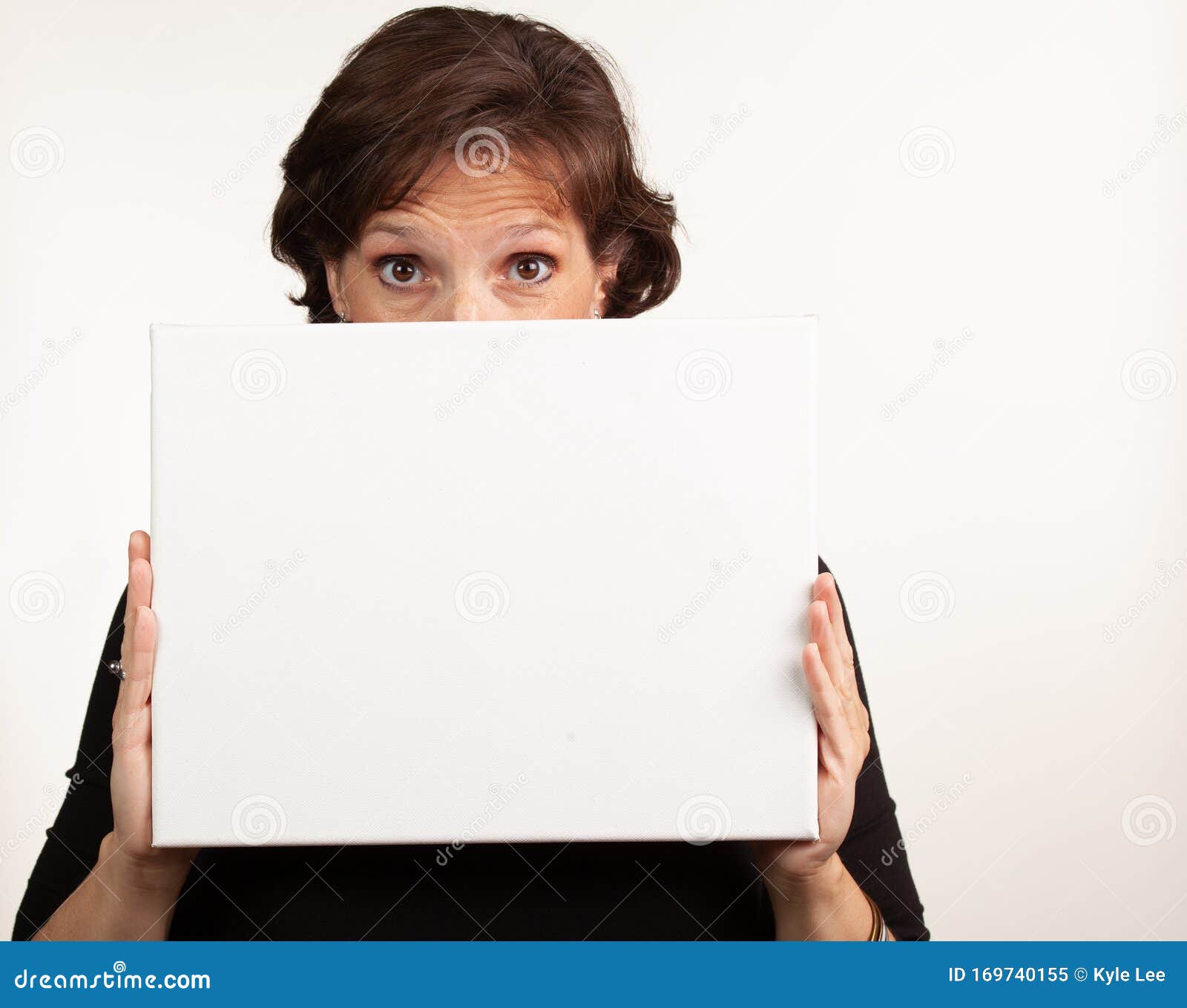 Woman Holding Up a Blank White Sign with Room for Your Copy Stock Image ...