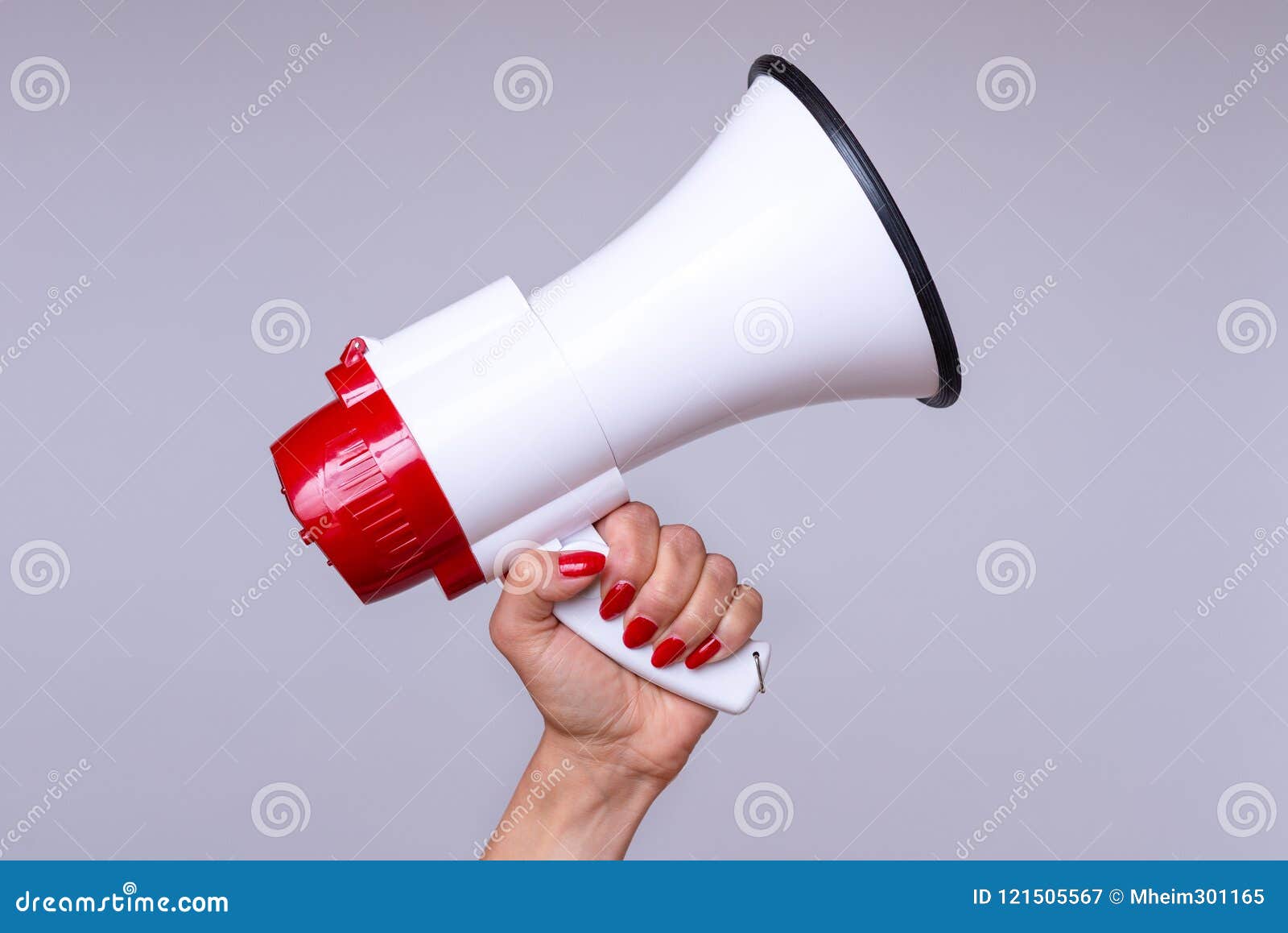 woman holding up a loud hailer or megaphone