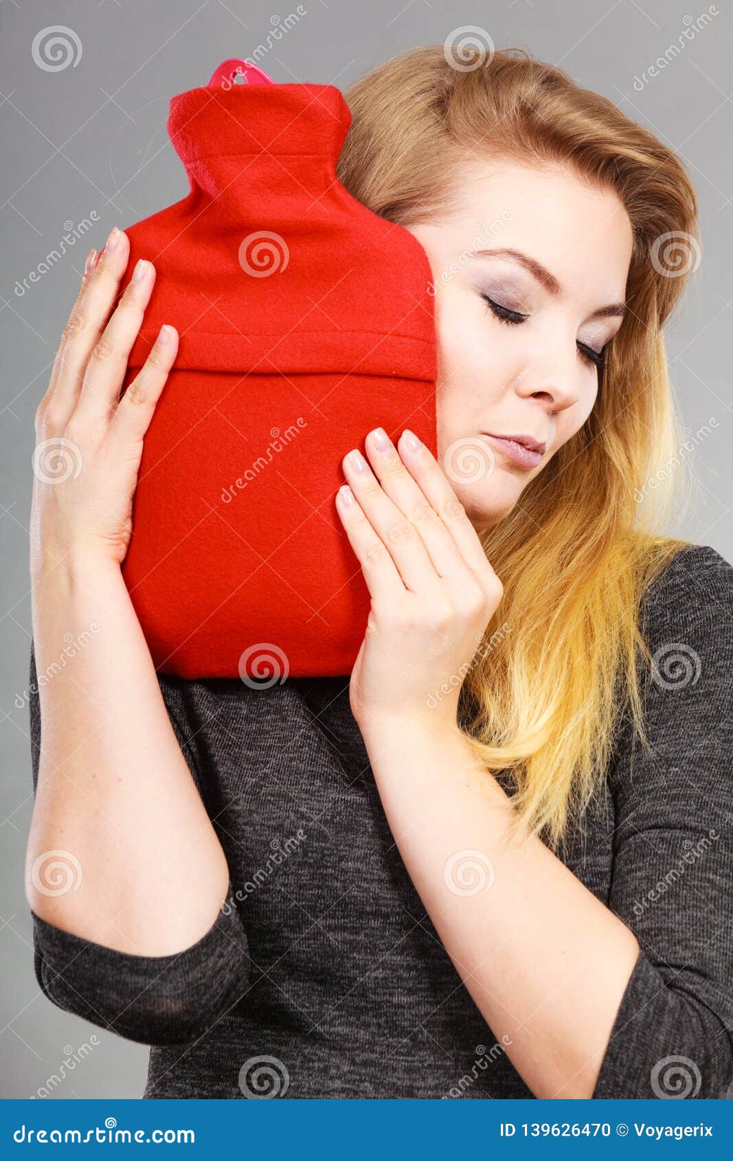 Woman Holding Warm Red Hot Water Bottle Stock Photo - Image of smiling