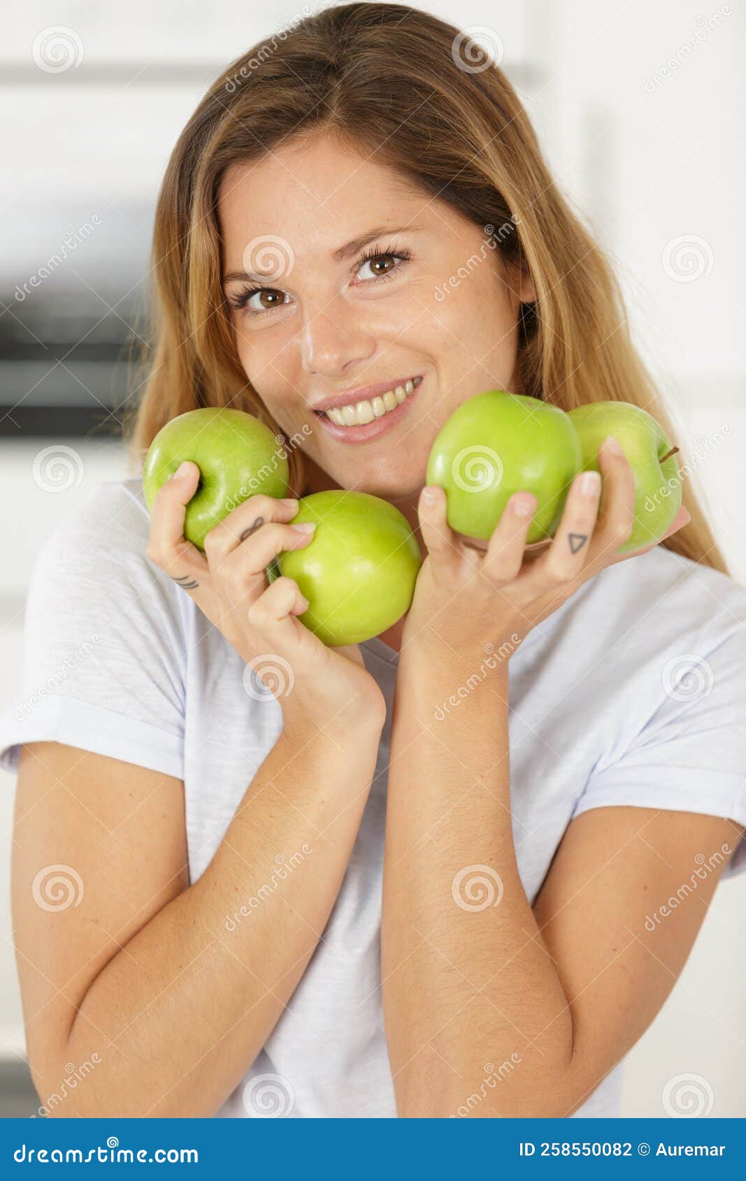 Woman holds green apples stock photo. Image of delicious 258550082