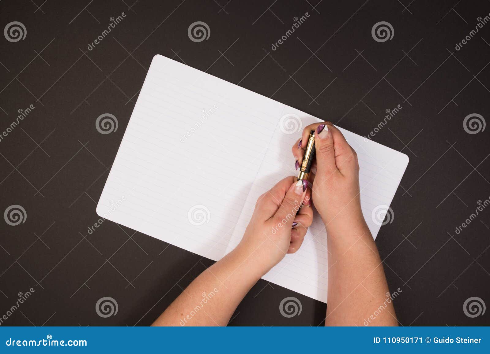 Woman Holds a Ink Pen Over Her Notebook Stock Image - Image of nails ...