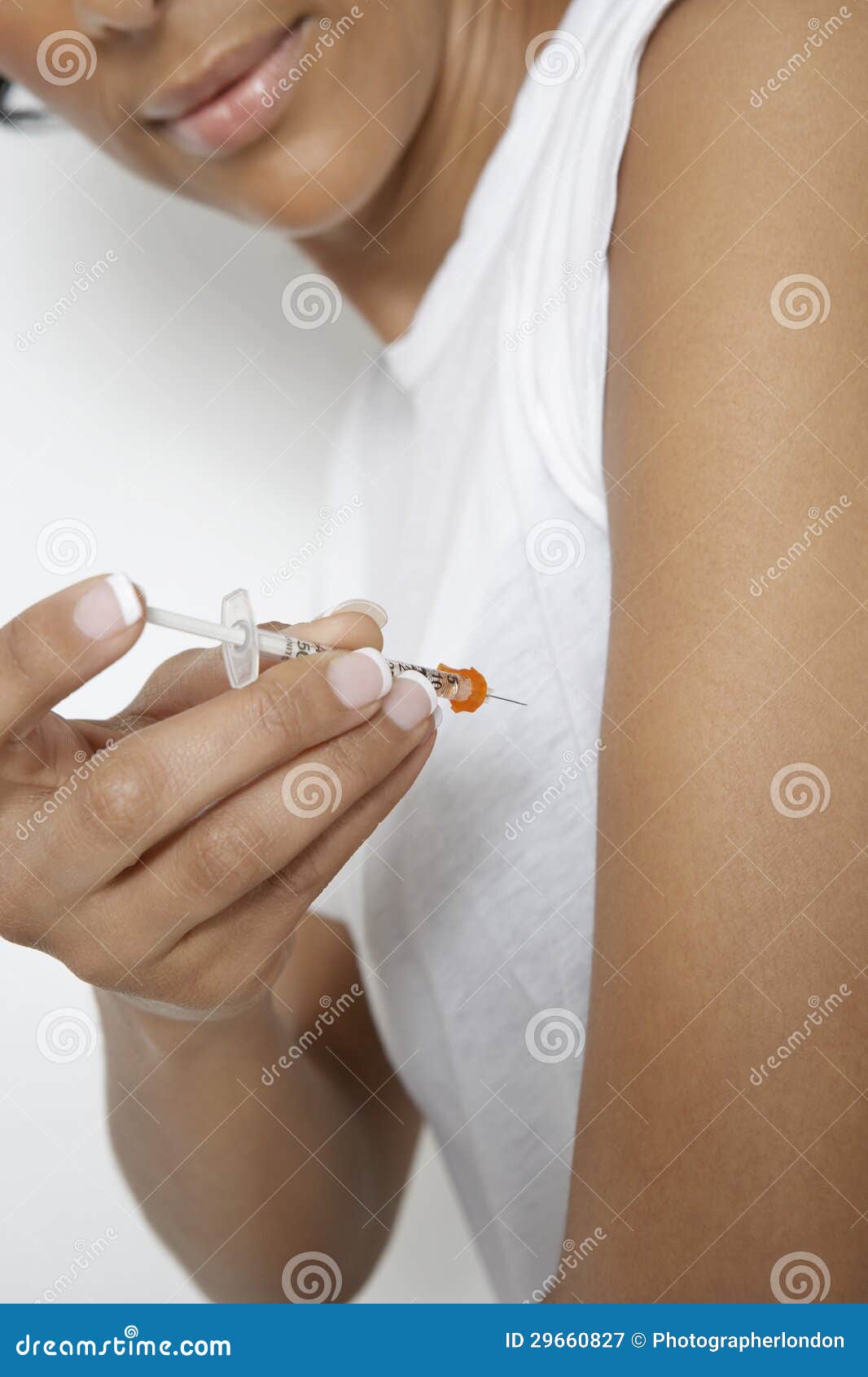 woman injecting insulin using syringe