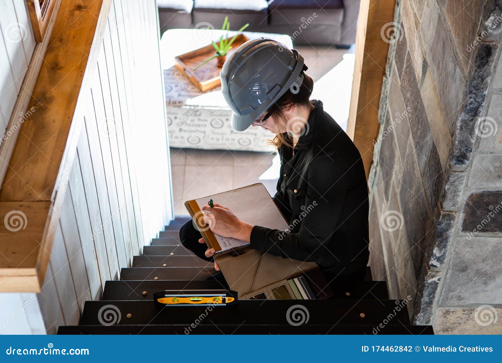 woman inspector reviewing stairs