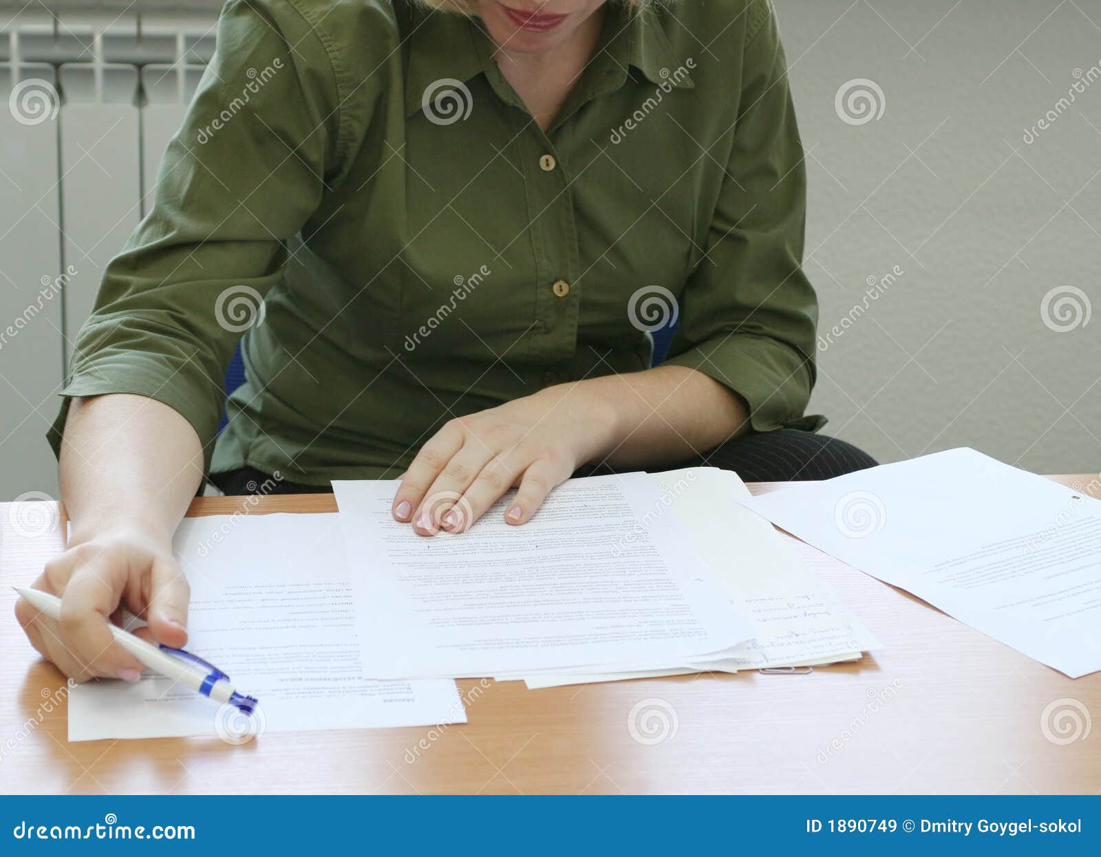 woman intently reading the documents (front)