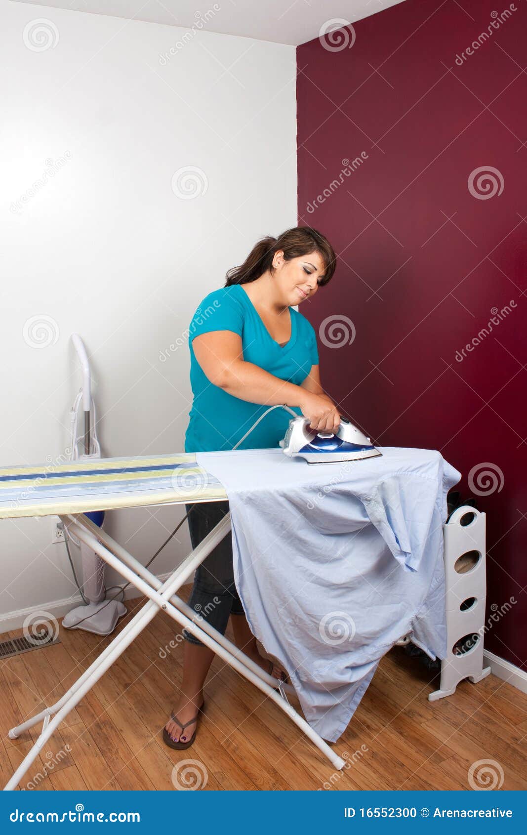 Woman Ironing Clothes stock photo. Image of duty, lifestyle 16552300