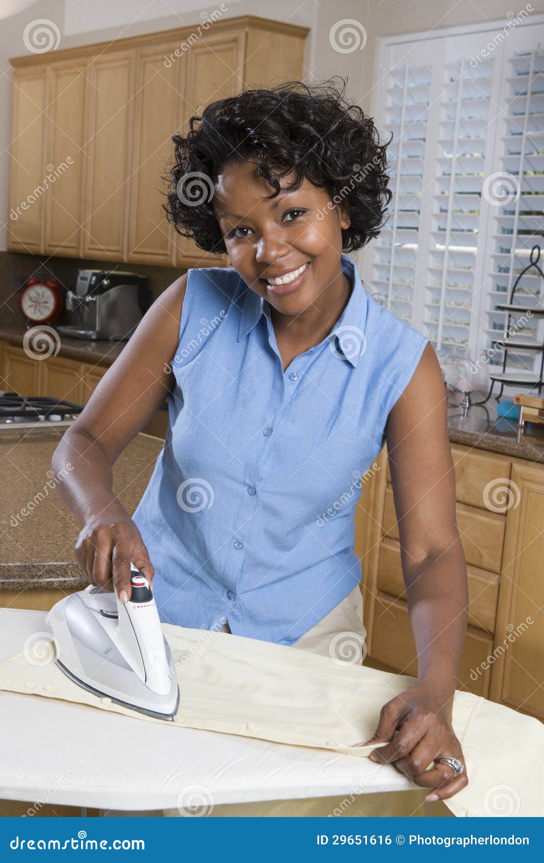 Woman Ironing Clothes in Kitchen Stock Photo Image of female