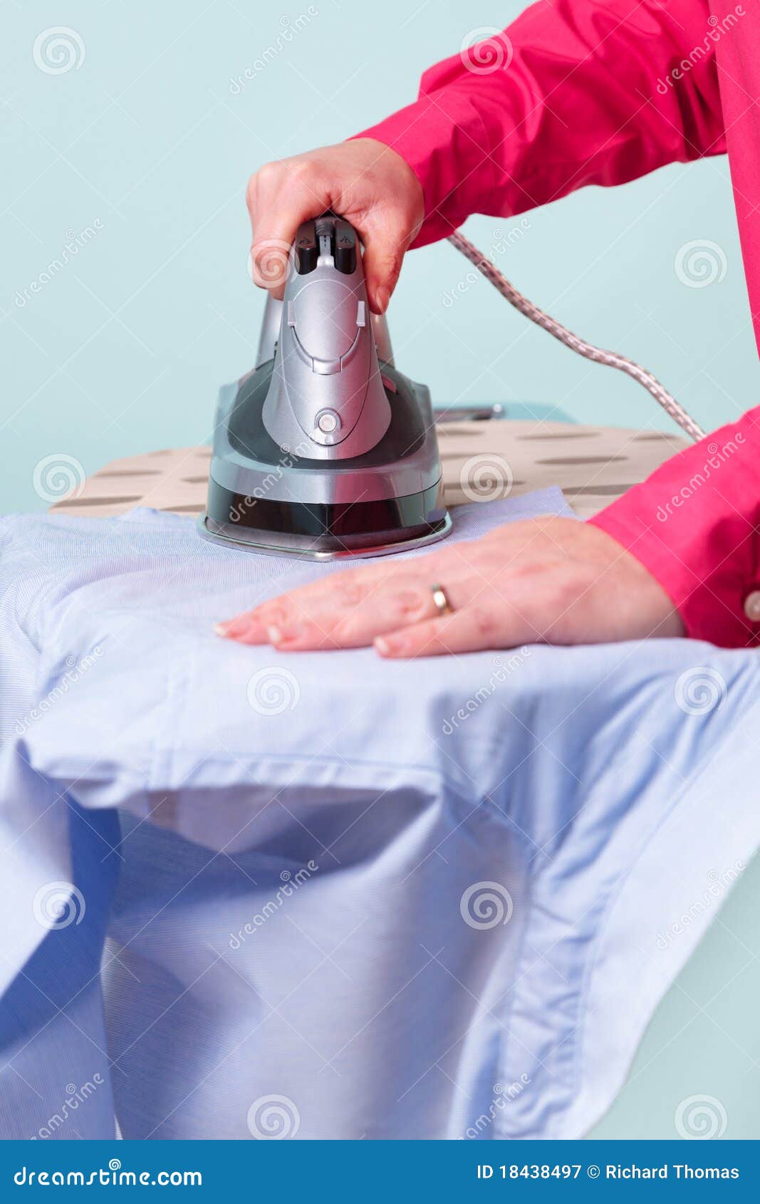 Woman ironing a shirt stock image. Image of people, single 18438497