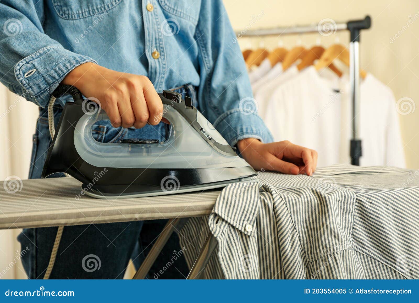 Woman in Jeans Ironing Shirt with Iron Stock Image Image of house