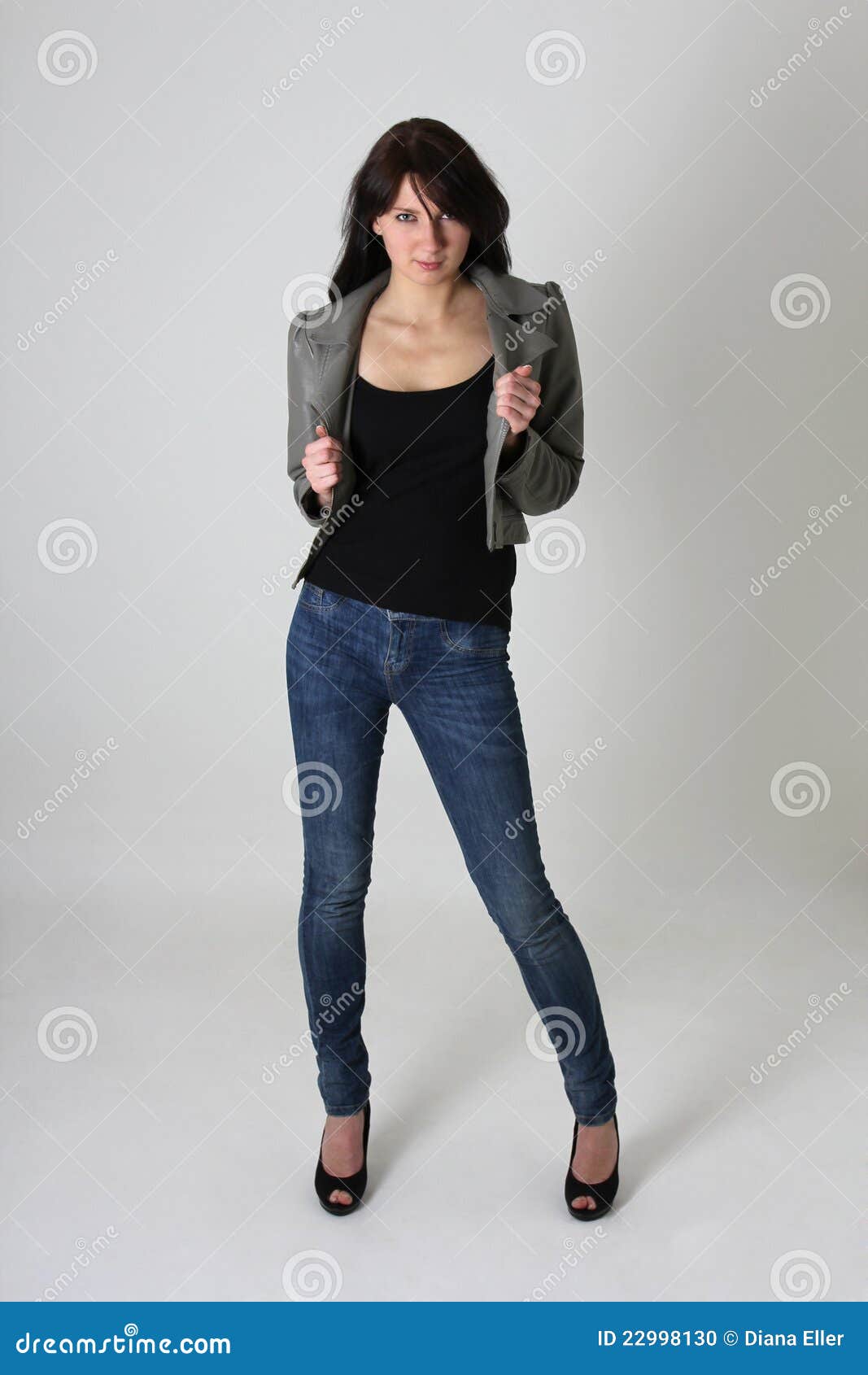 Woman In Jeans And Leather Jacket Over Grey Stock Photo Image of style, clothes 22998130