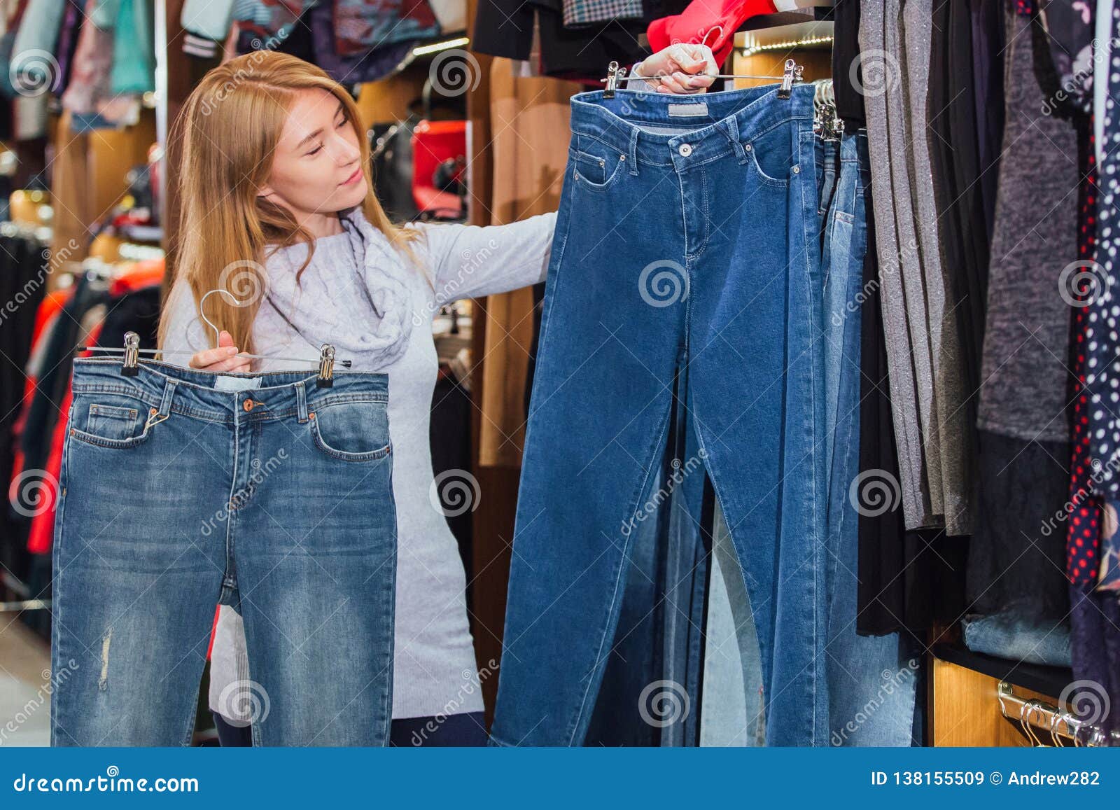 Woman with Jeans and Shopping in a Fashionable Clothing Store. Stock ...