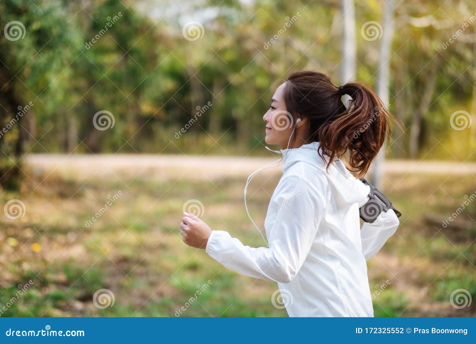 A Woman Jogging in City Park in the Morning Stock Photo - Image of girl ...