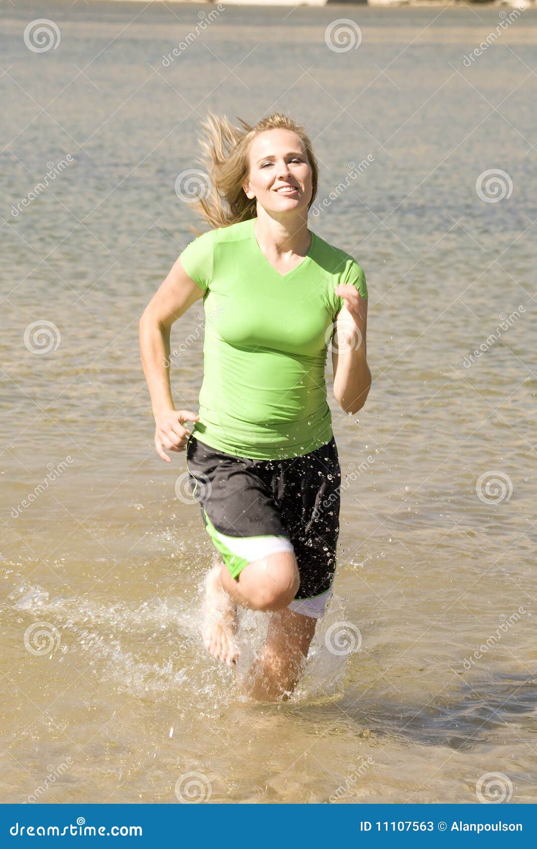 Woman jogging in water stock image. Image of splashing 11107563