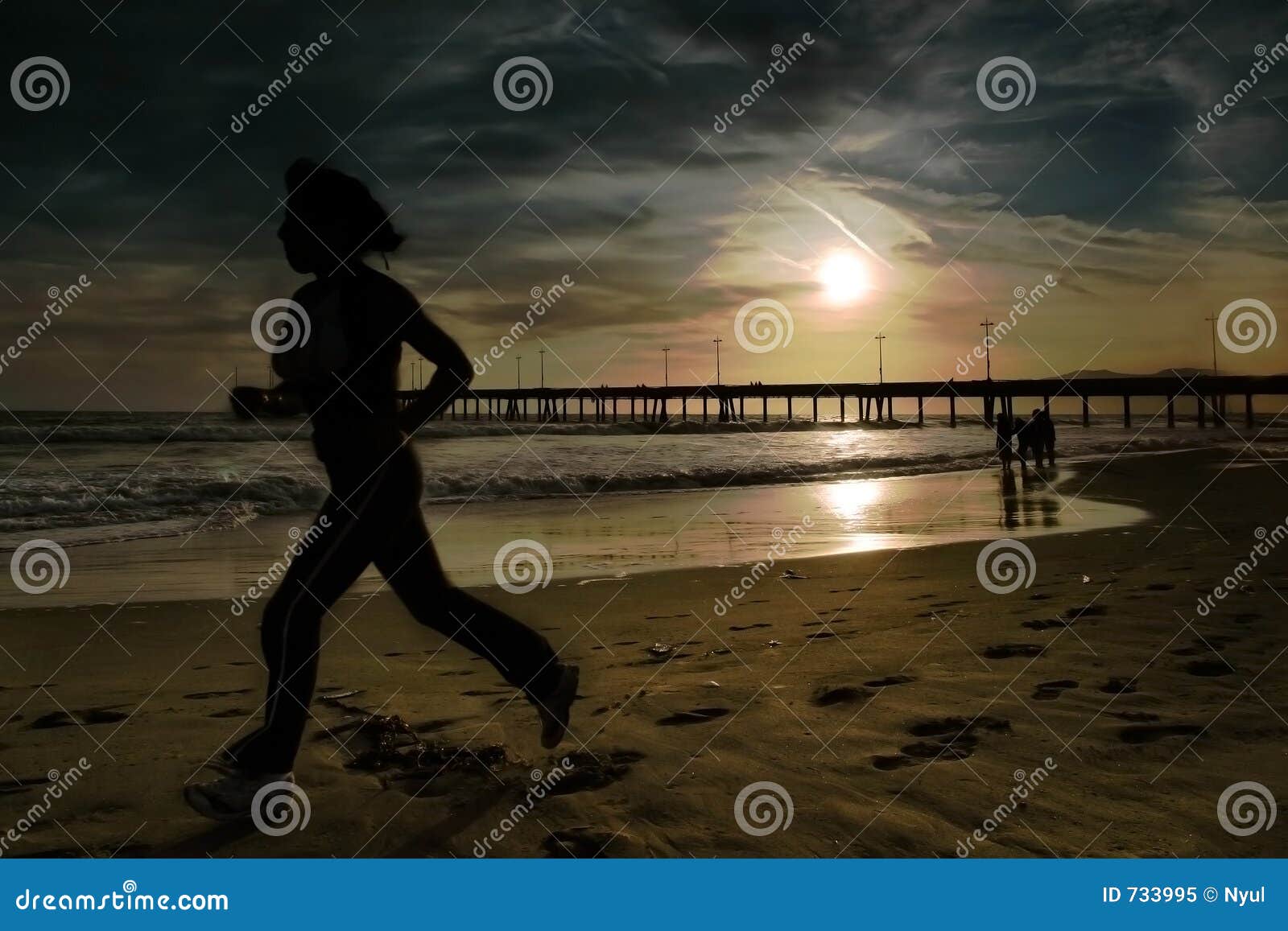 woman joggs on the beach