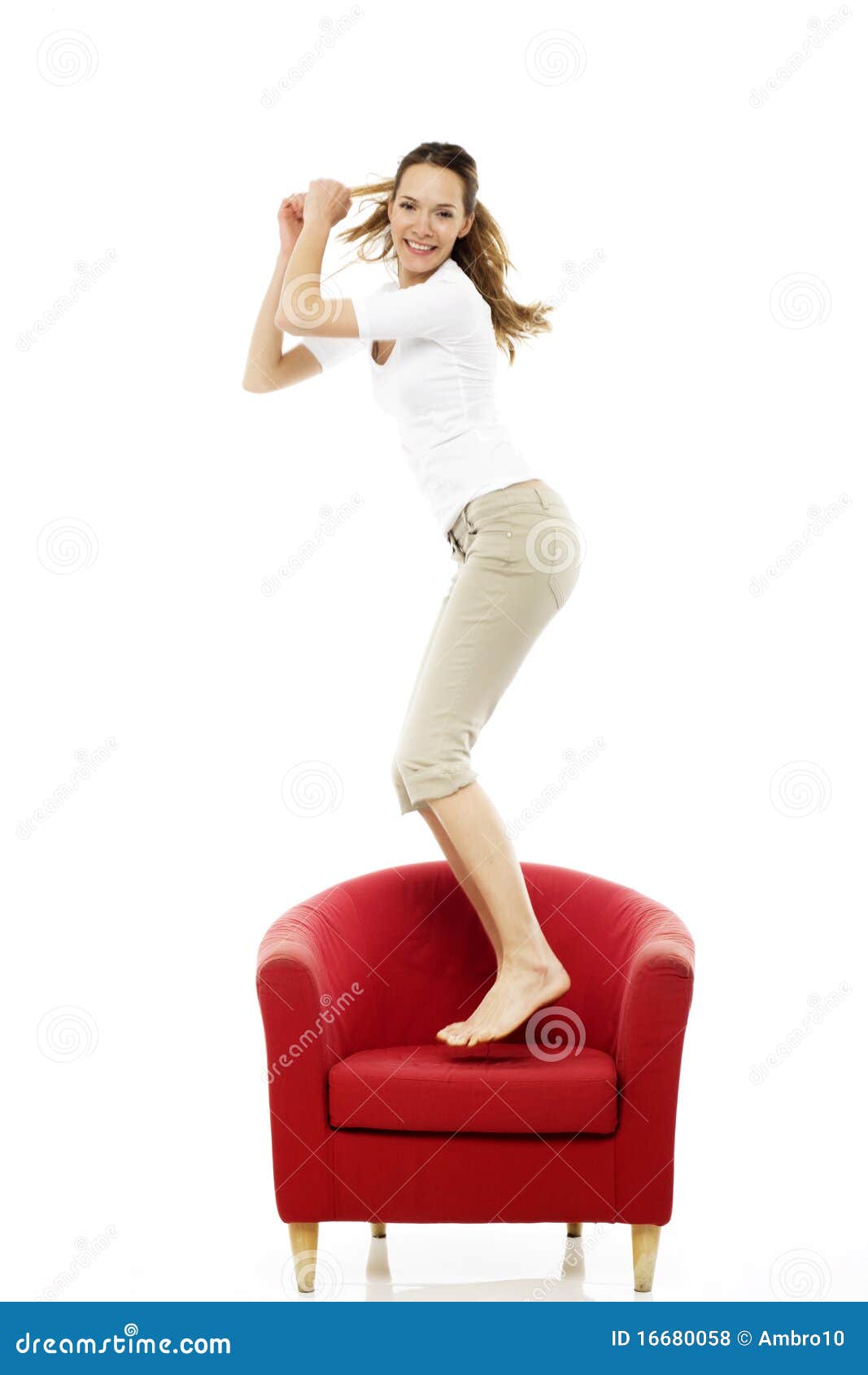 Woman jumping on a chair stock photo. Image of caucasian 16680058