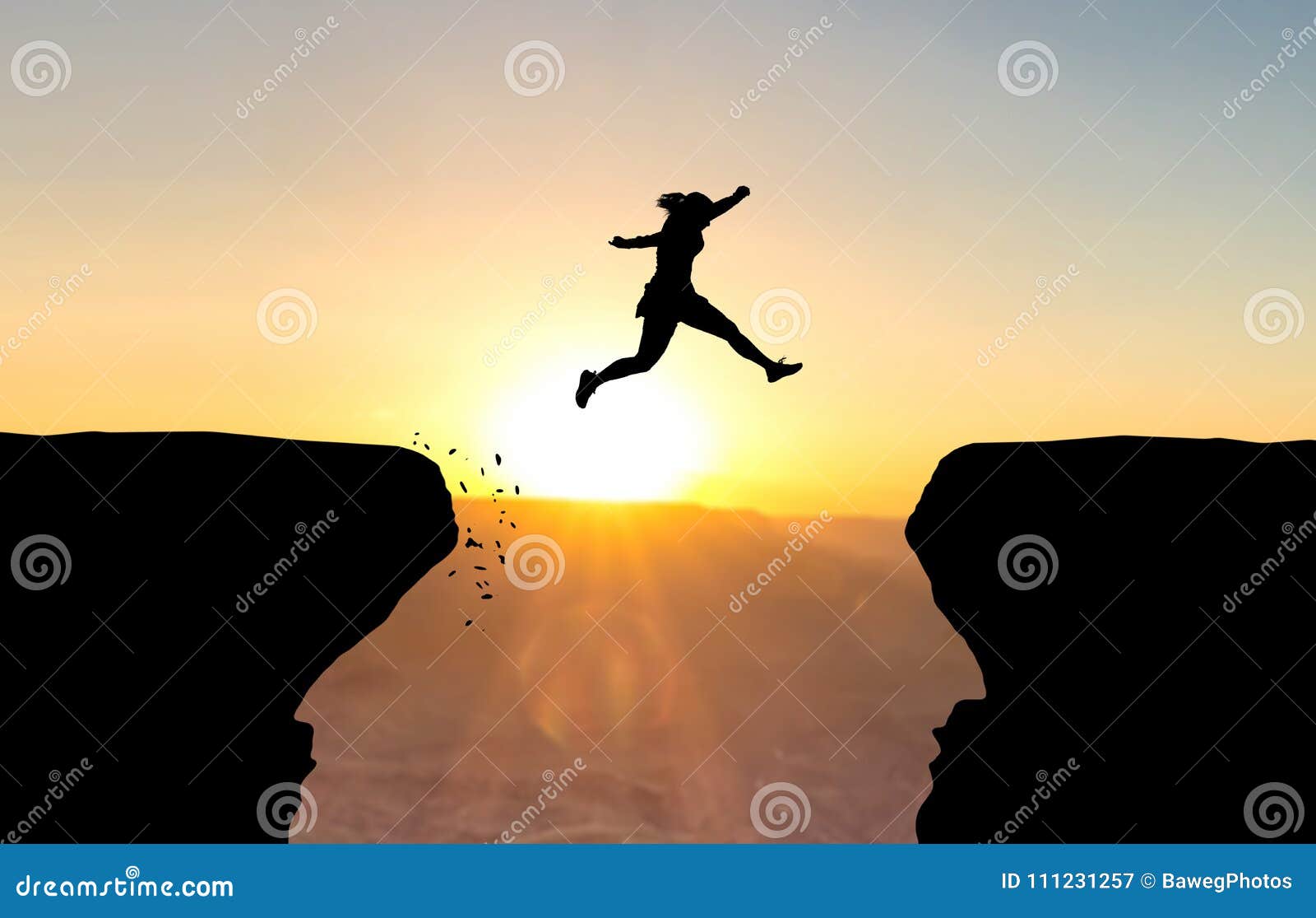 woman jumping over abyss.