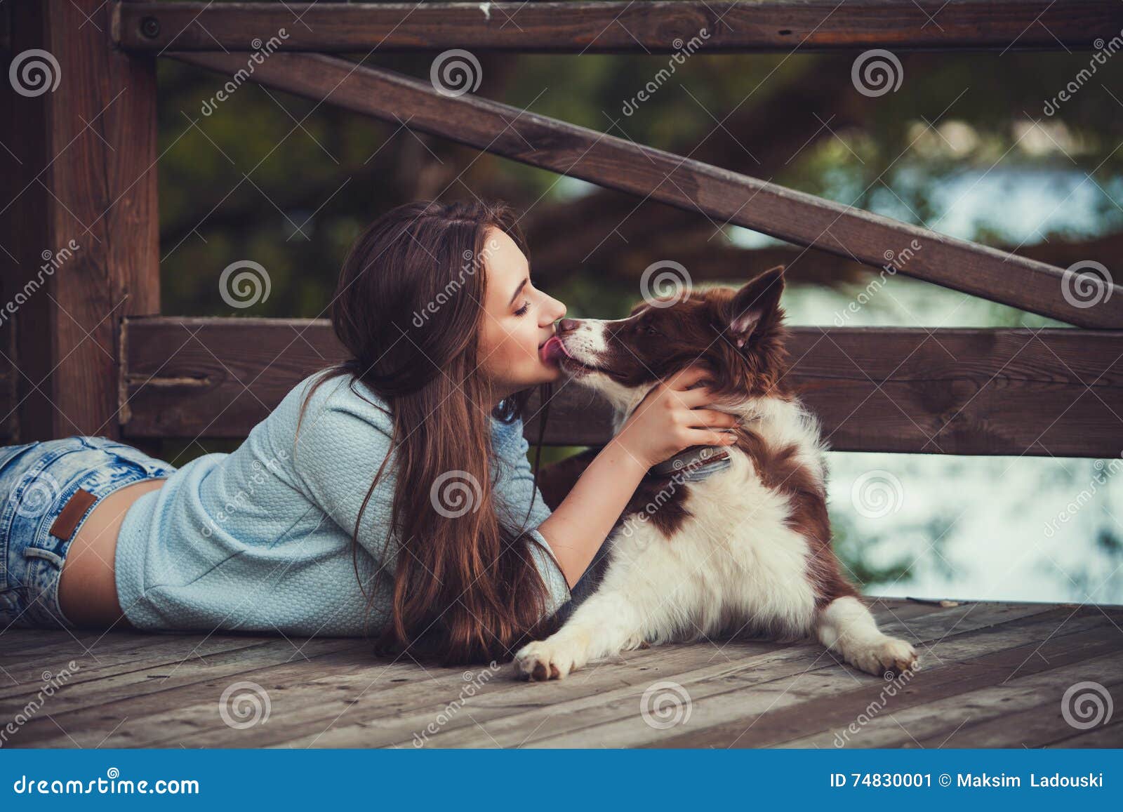 Woman kissing her dog stock image. Image of cute, blue 74830001