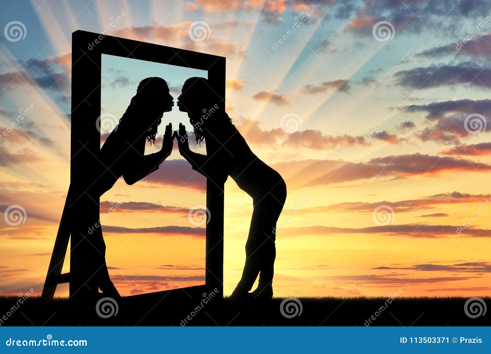 woman is kissing her reflection in the mirror