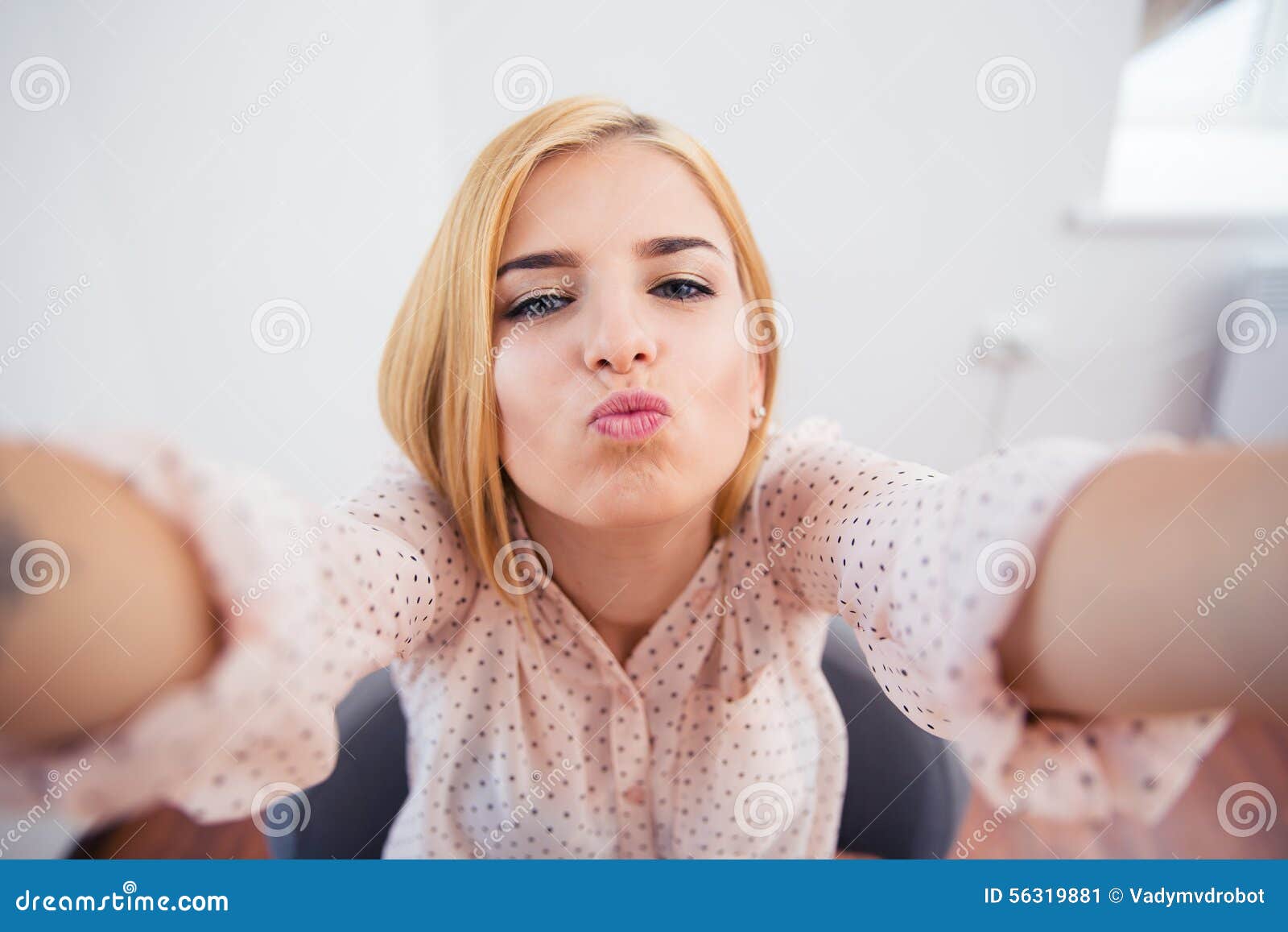 woman kissing selfie