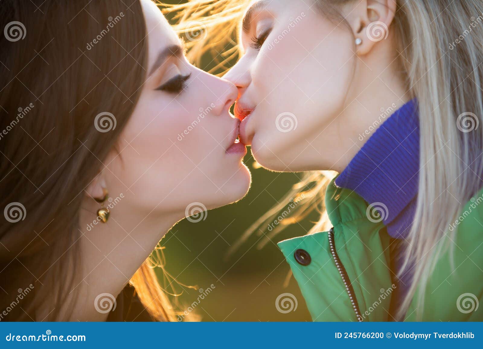 Two Young Attractive Lesbians Kissing Stock Photos pic