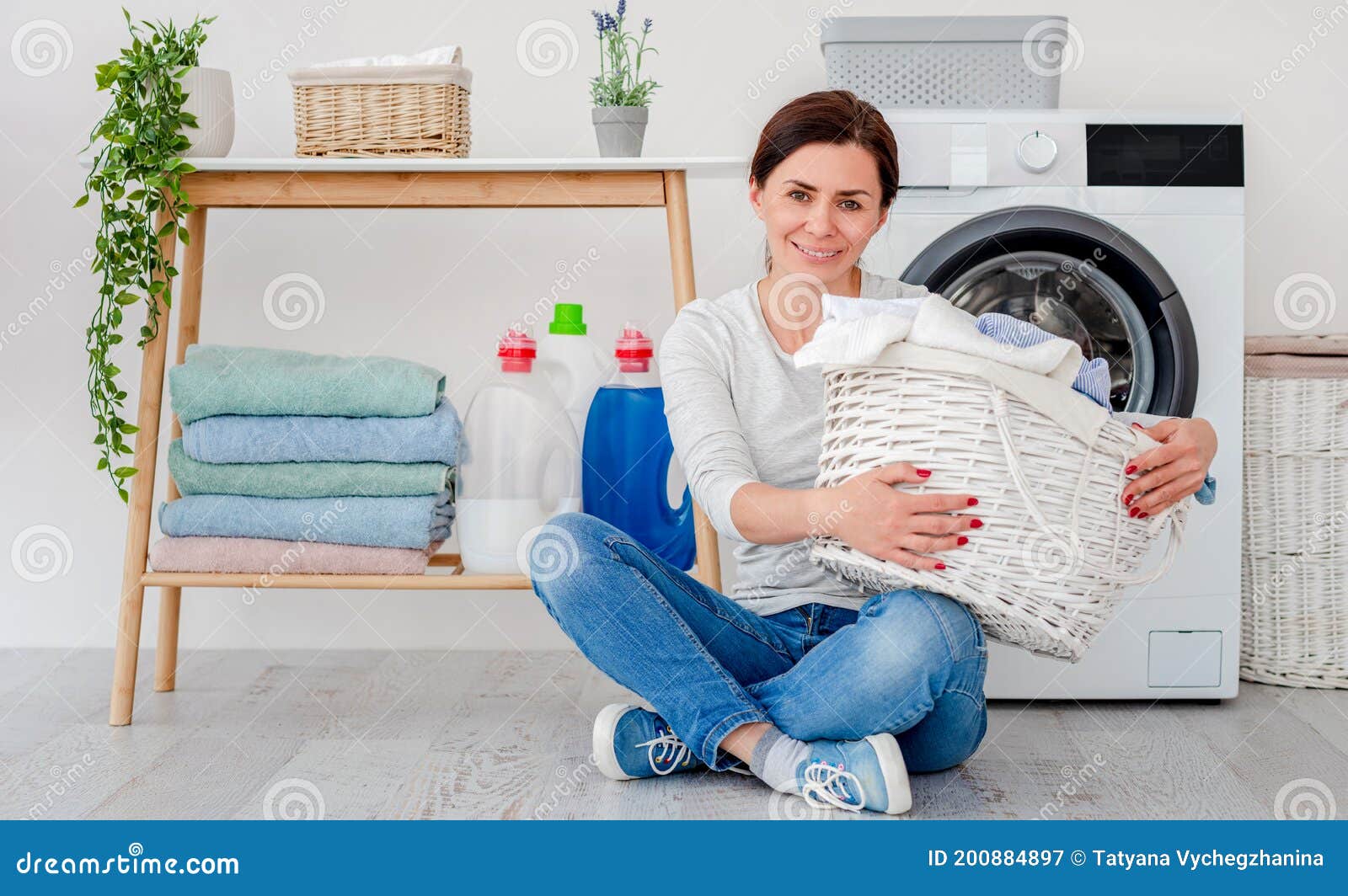 Woman with Laundry Basket Sitting on Floor Stock Image - Image of ...