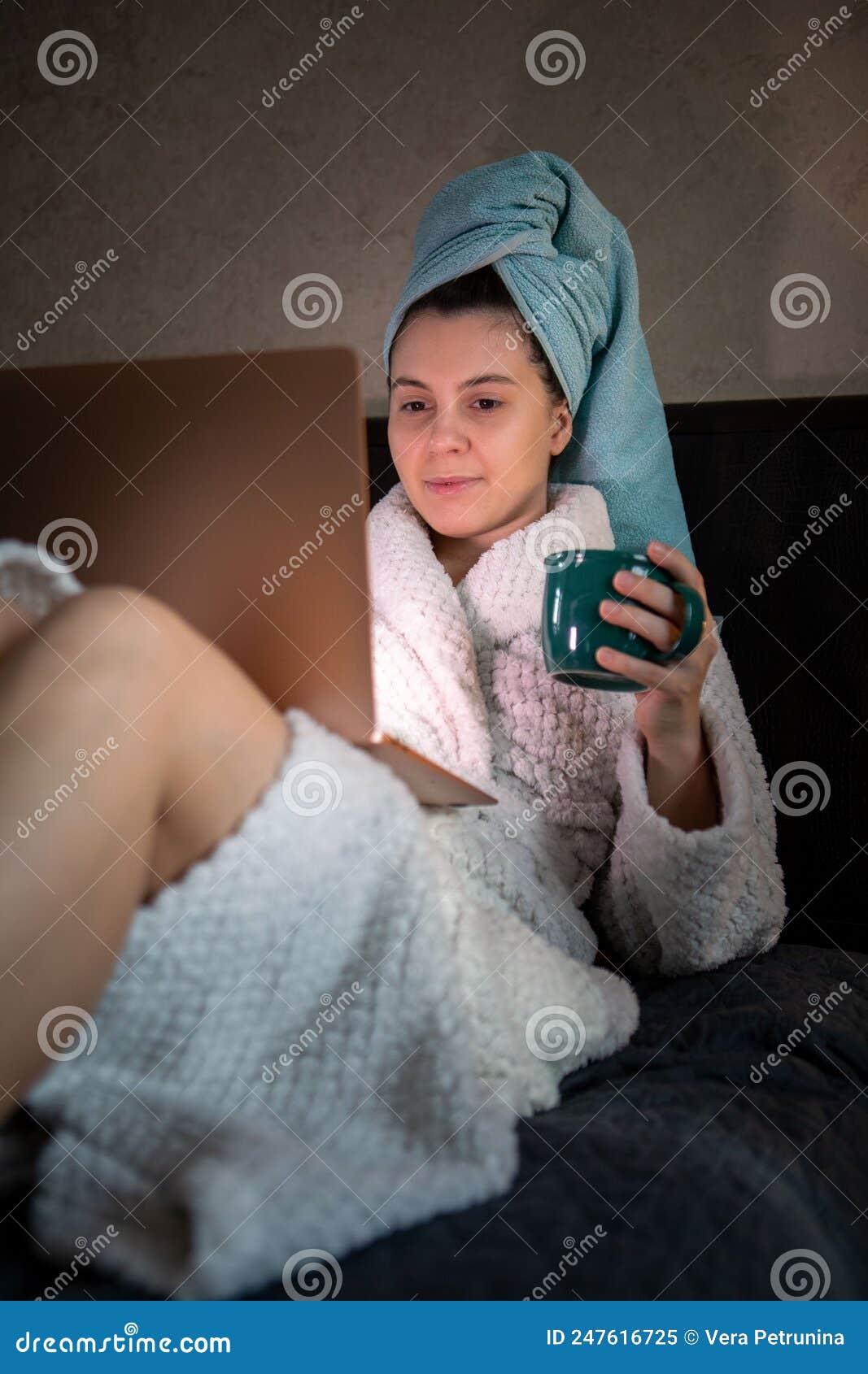 Woman Laying Down In Bed With Wet Head Covered With Towel Working On Laptop Stock Image Image