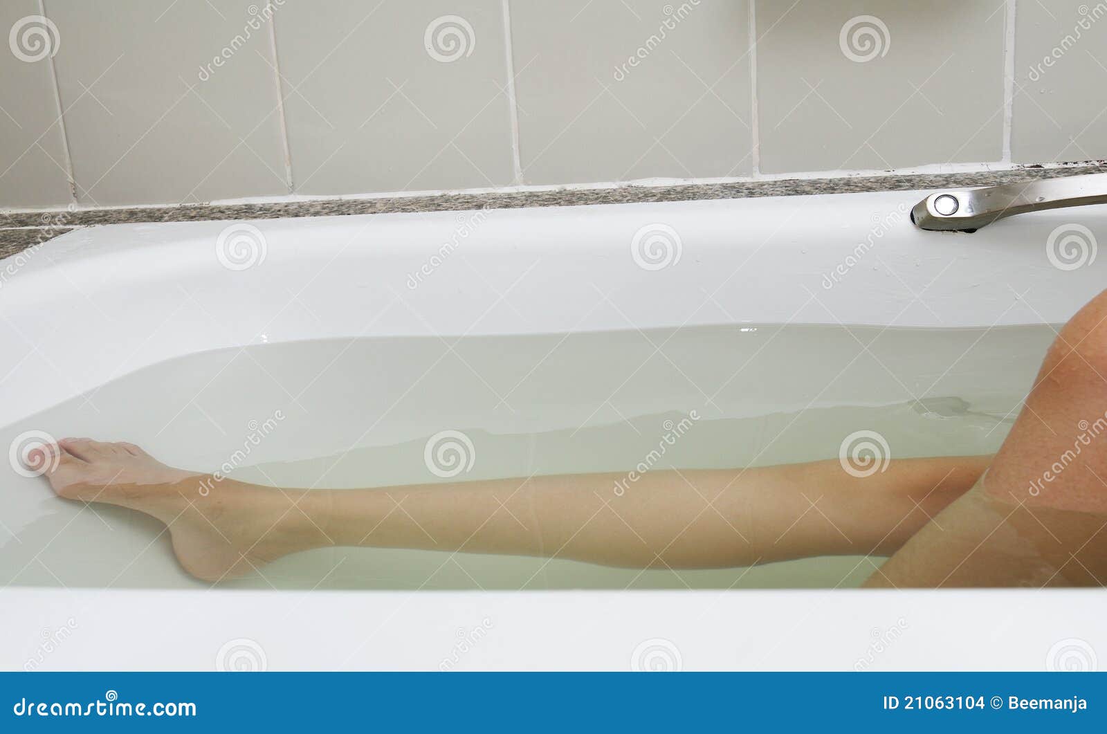 Woman legs in bathtub stock photo. Image of girl, people 21063104