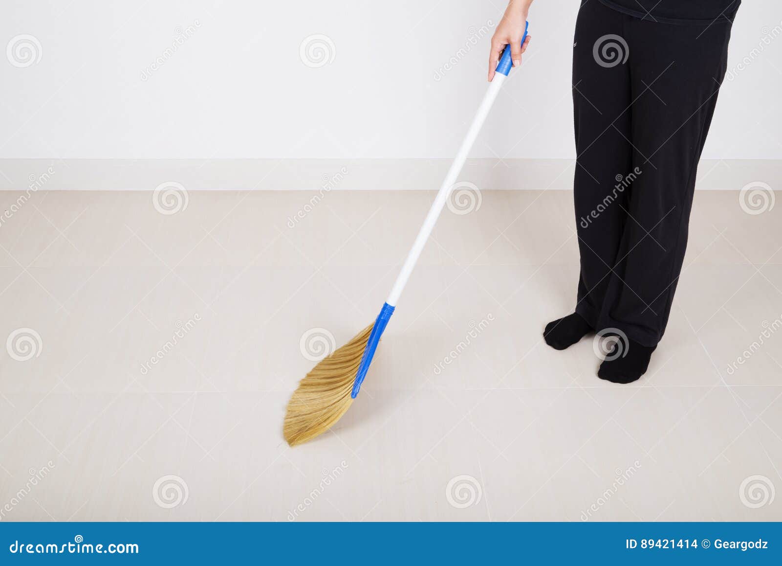 Woman Legs with Broom Sweeping Floor Stock Photo Image of closeup