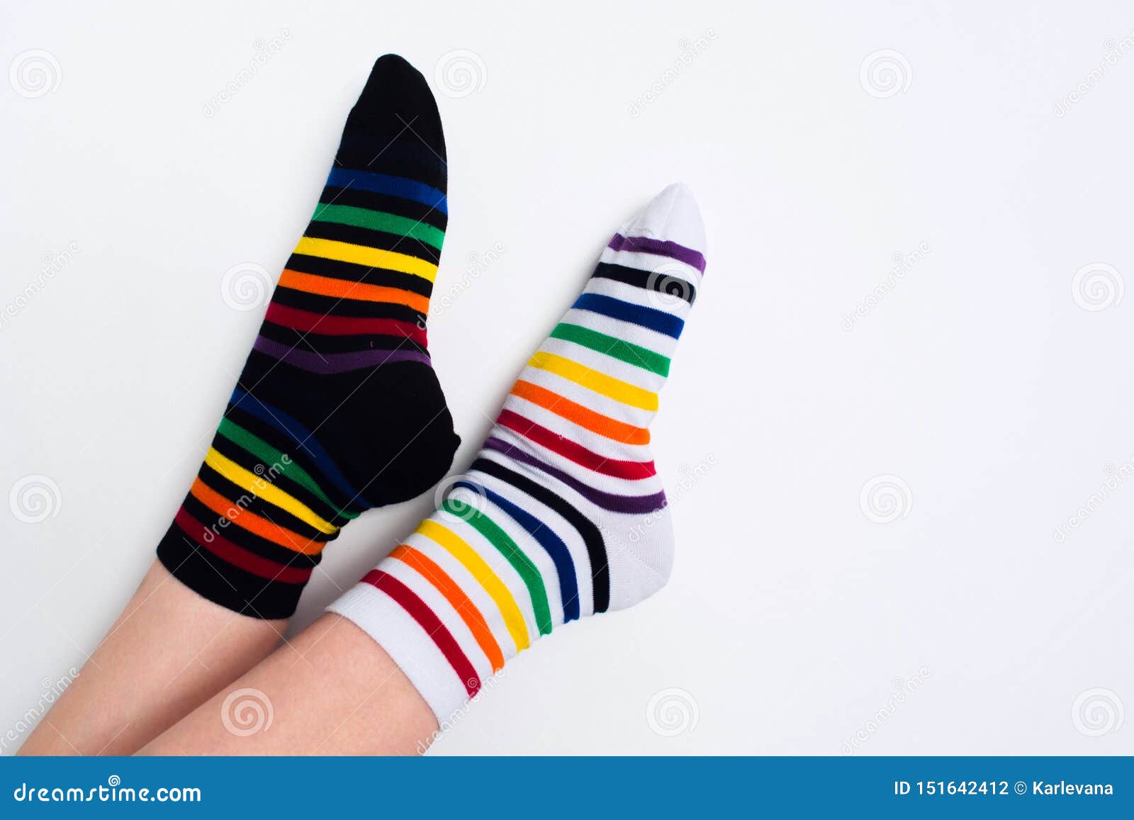 Woman Legs Wearing Funny Bright Different Striped Colorful Socks on ...