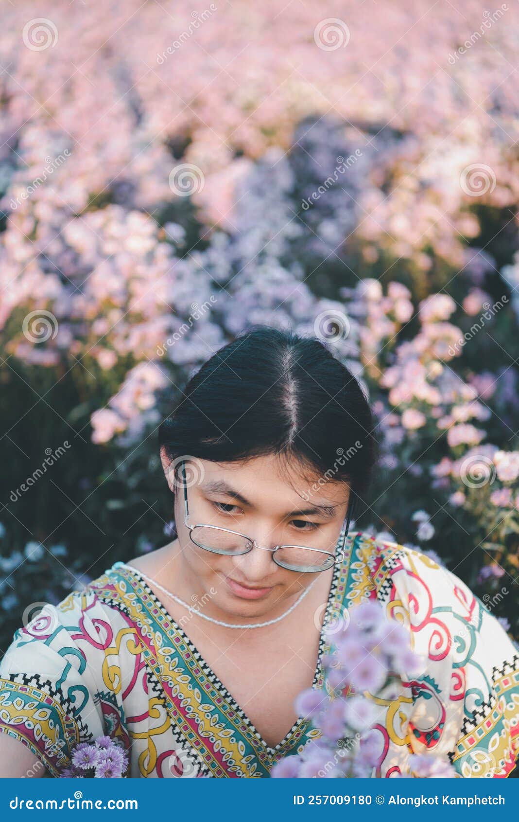 woman (lgbtq) posing at flower park garden field