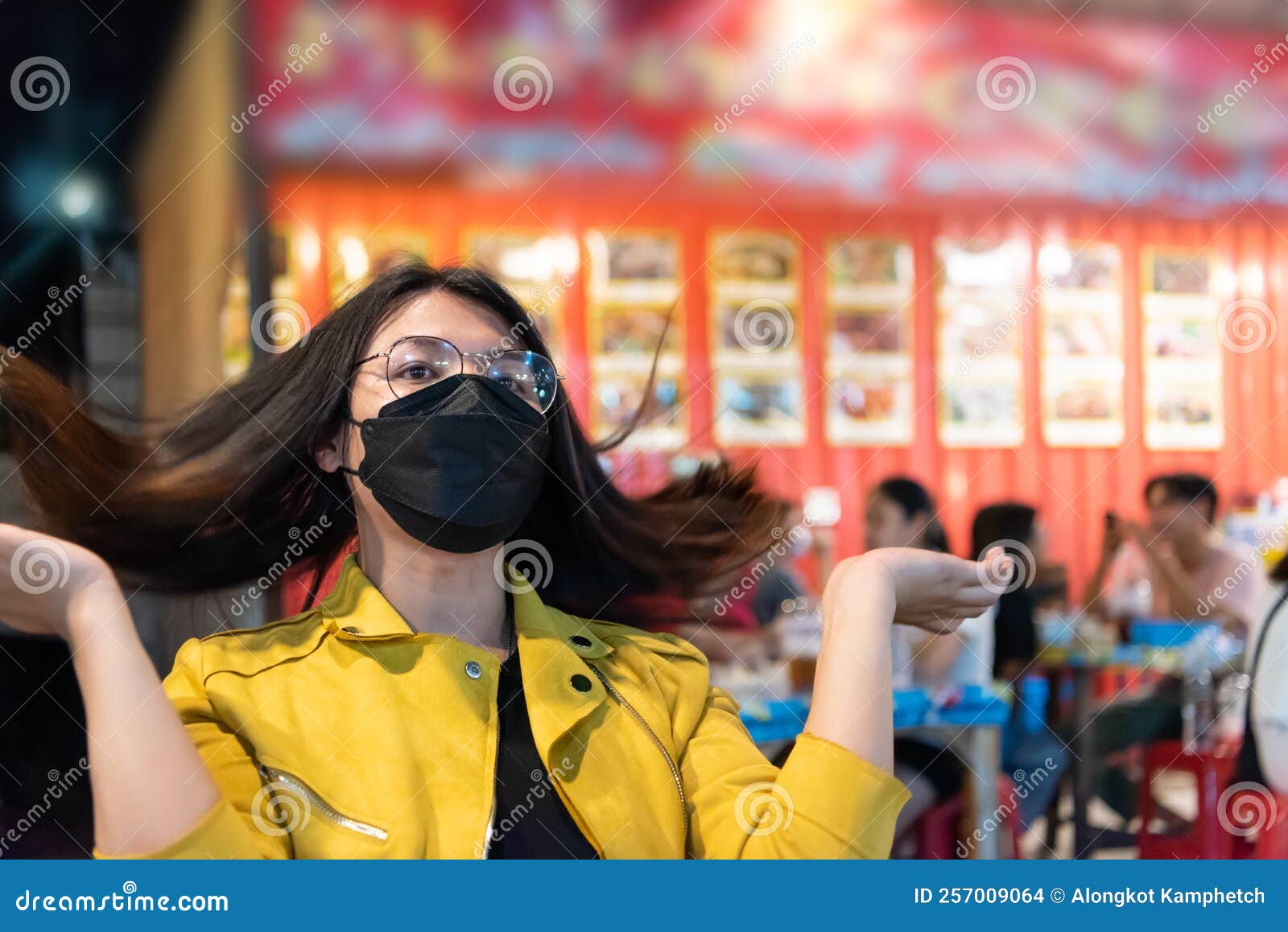 woman (lgbtq) posing with food at thai street food