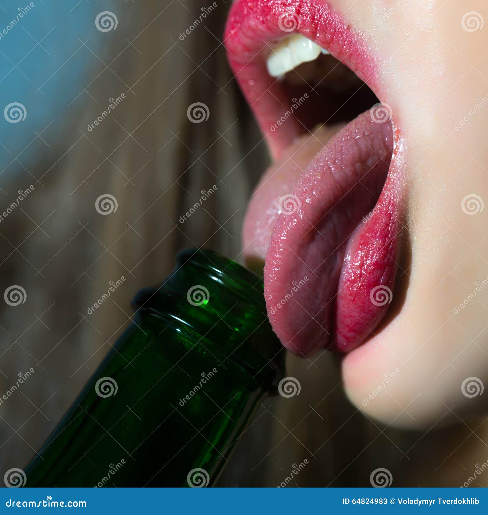 woman-licking-bottle-closeup-view-female-facial-body-part-sexual-lips-bright-red-lipgloss-tongue-open-mouth-64824983.jpg