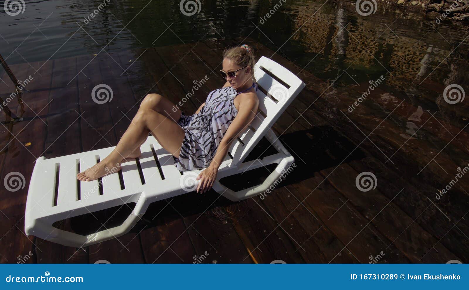 Woman Lie on a Sunbed in Sunglasses and a Boho Silk Shawl. Girl Rest on ...