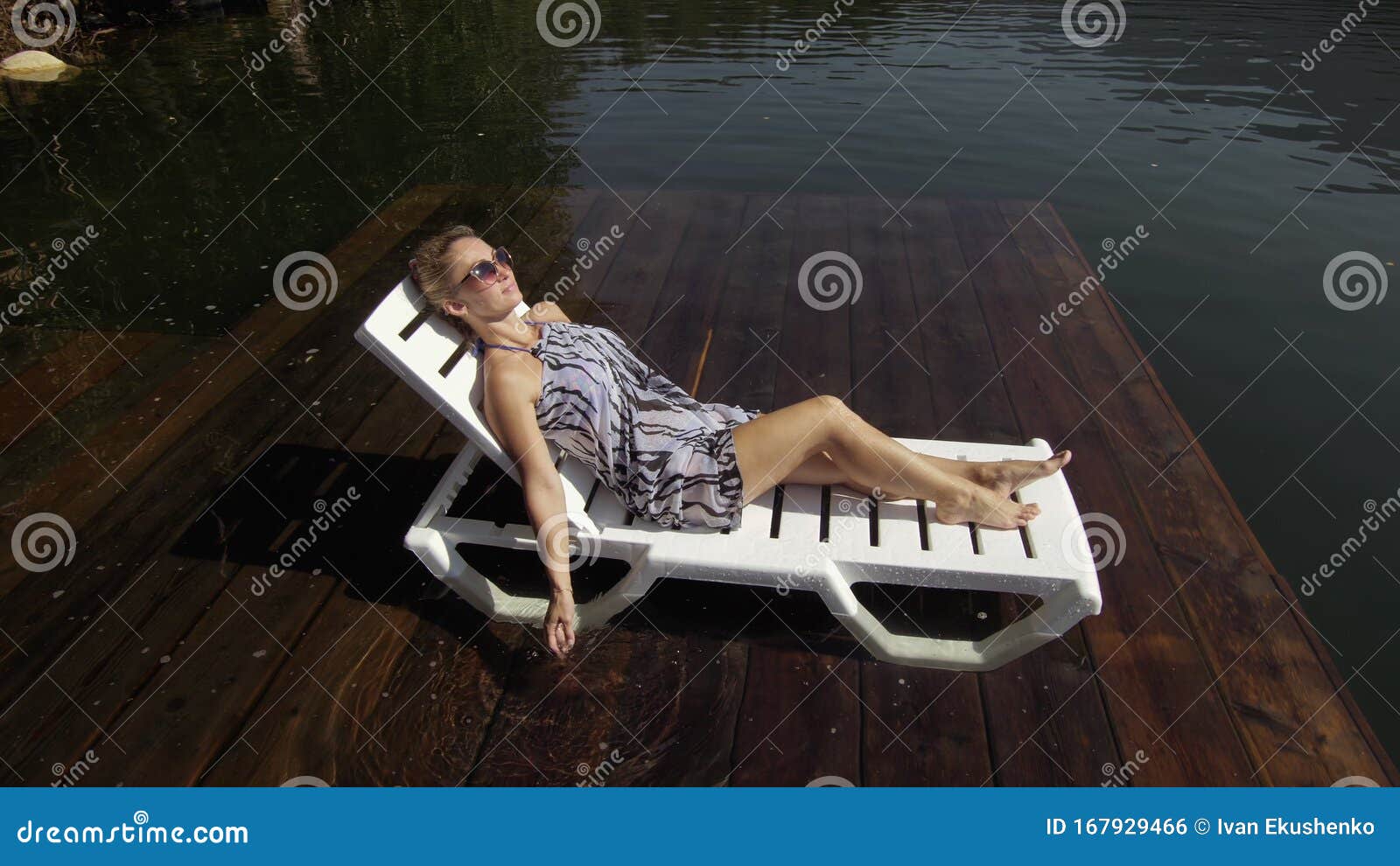 Woman Lie on a Sunbed in Sunglasses and a Boho Silk Shawl. Girl Rest on ...