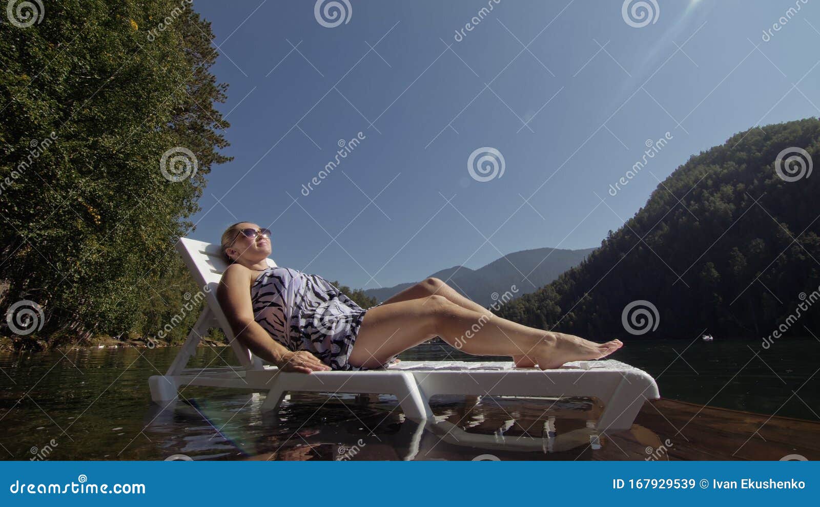 Woman Lie on a Sunbed in Sunglasses and a Boho Silk Shawl. Girl Rest on ...