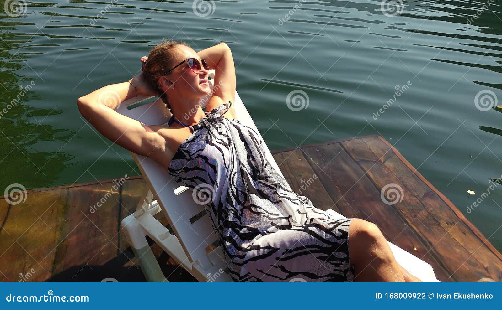 Woman Lie on a Sunbed in Sunglasses and a Boho Silk Shawl. Girl Rest on ...