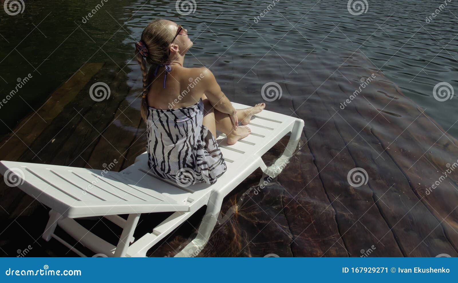 Woman Lie on a Sunbed in Sunglasses and a Boho Silk Shawl. Girl Rest on ...