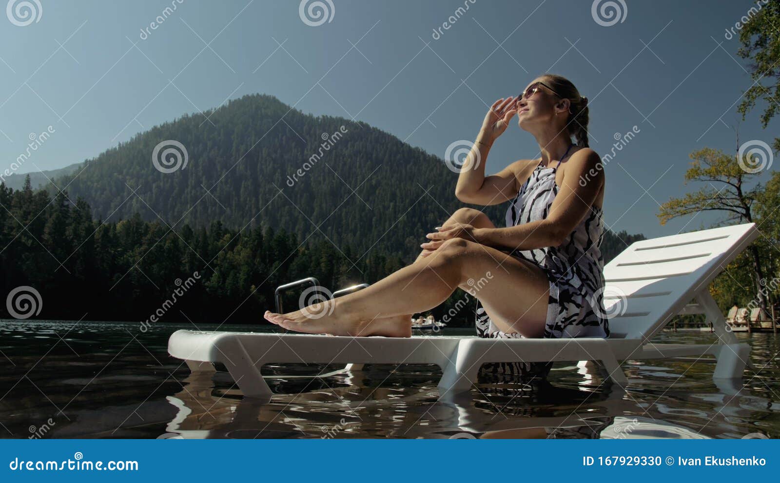 Woman Lie on a Sunbed in Sunglasses and a Boho Silk Shawl. Girl Rest on ...