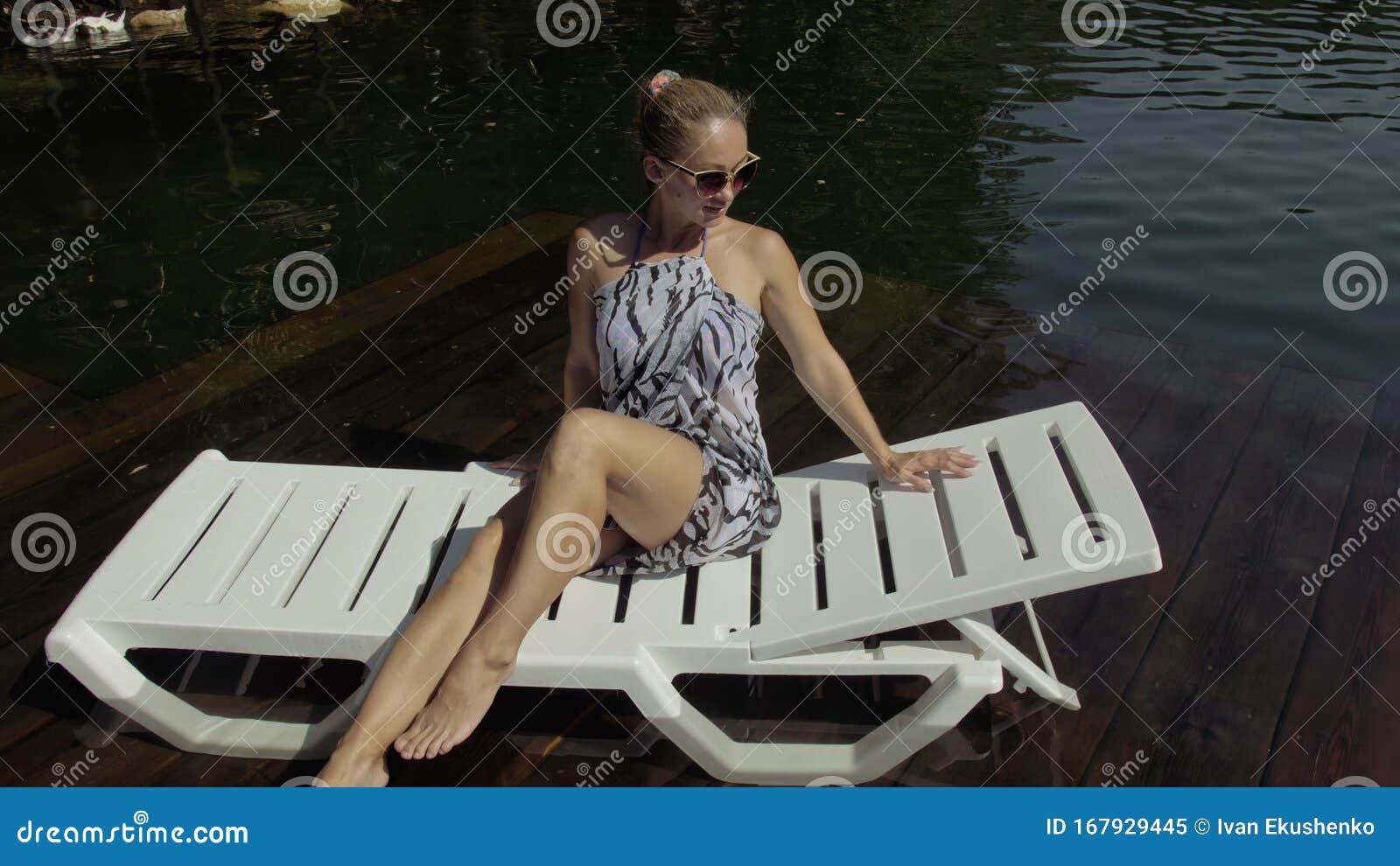 Woman Lie on a Sunbed in Sunglasses and a Boho Silk Shawl. Girl Rest on ...