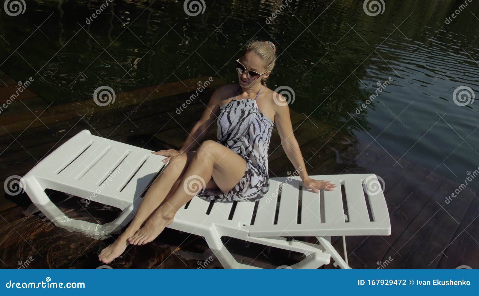 Woman Lie on a Sunbed in Sunglasses and a Boho Silk Shawl. Girl Rest on ...