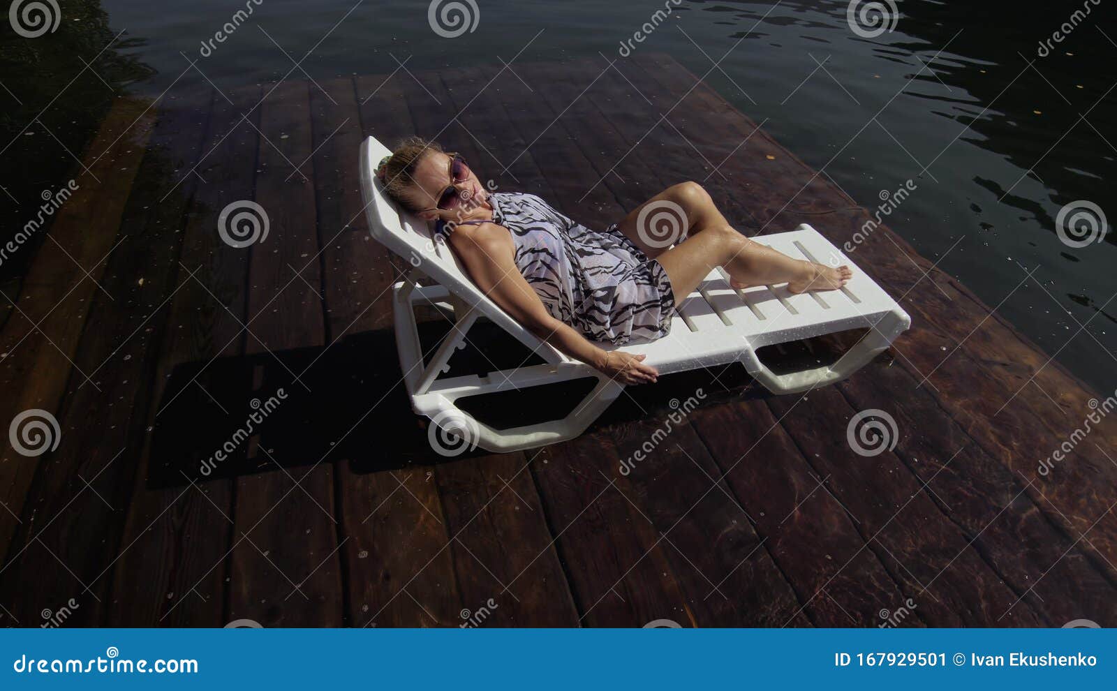 Woman Lie on a Sunbed in Sunglasses and a Boho Silk Shawl. Girl Rest on ...