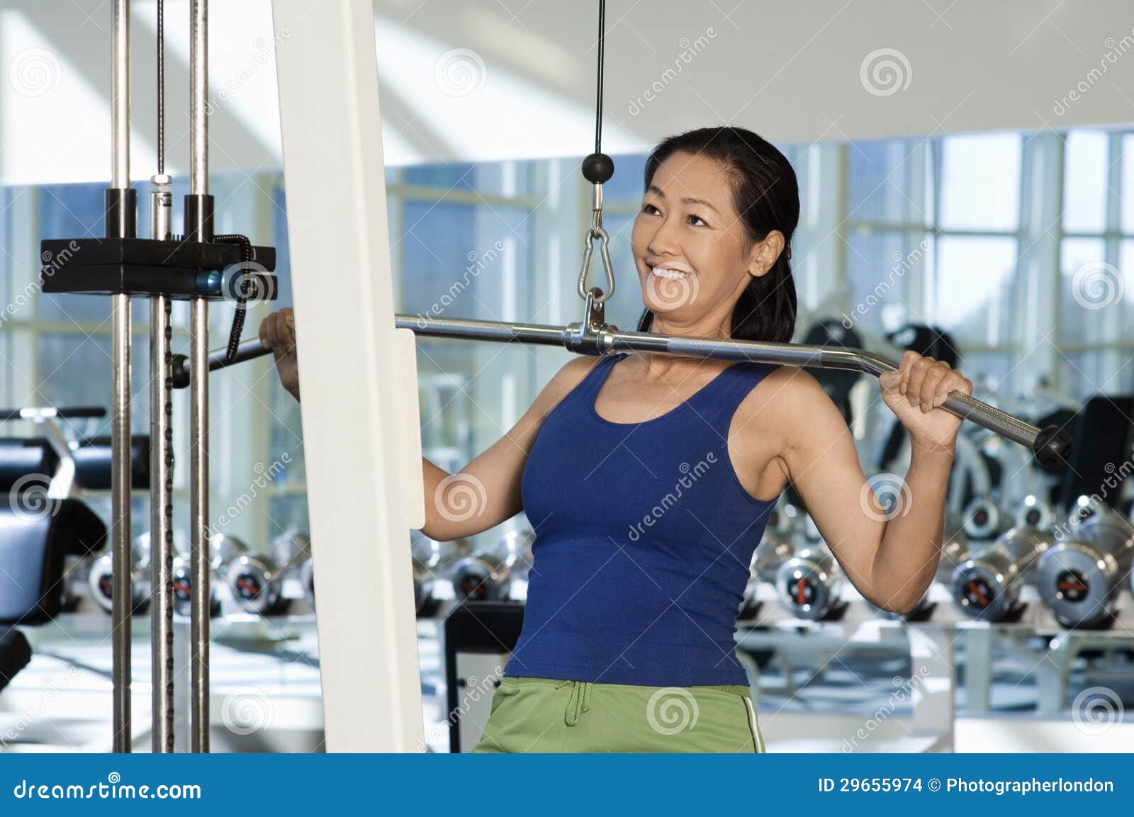 Woman Lifting Weights on a Lat Pull Machine Stock Photo Image of