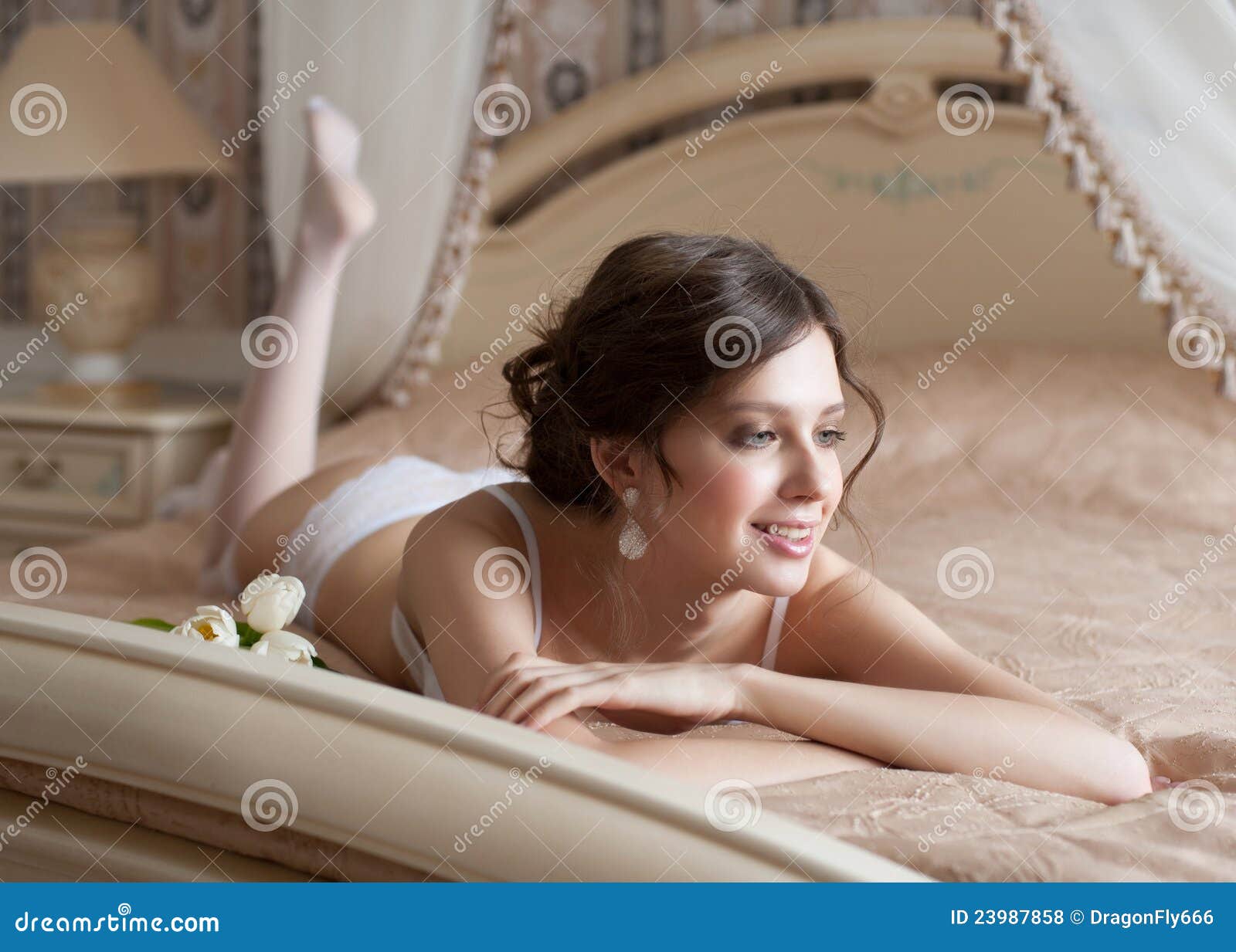 Woman In Lingerie Lying On Bed Stock Photo - Image: 23987858