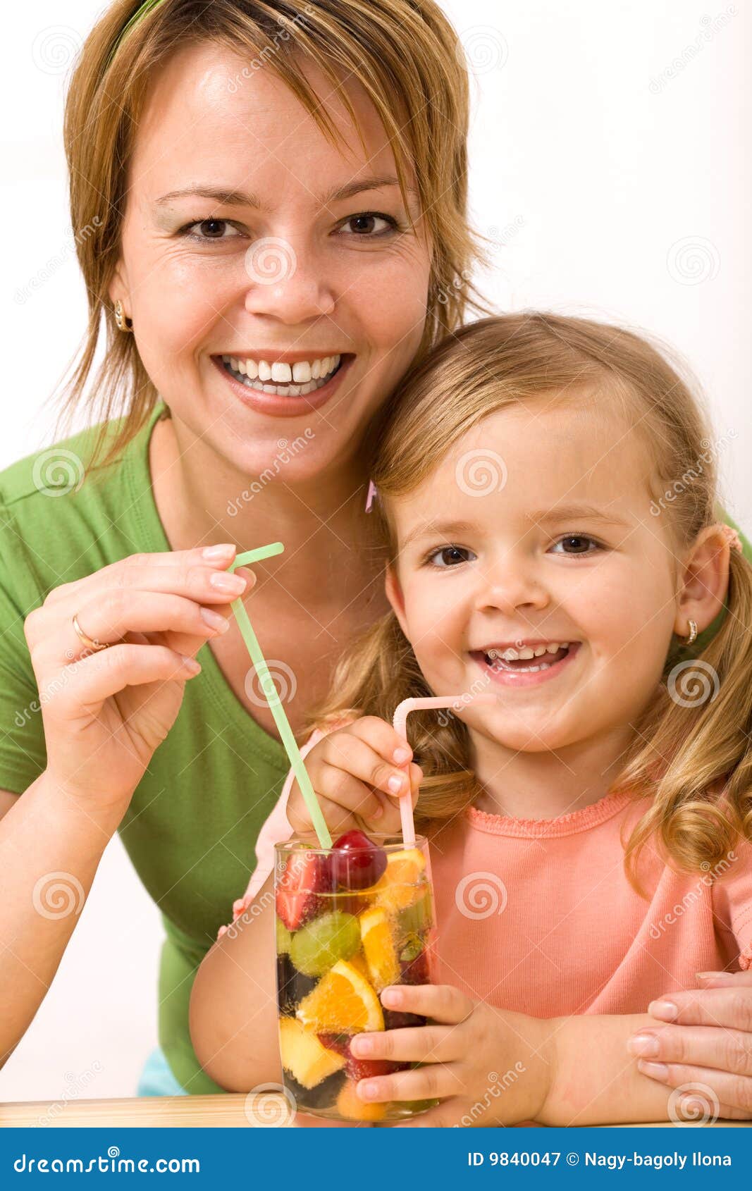 woman and little girl having a fruity refreshment