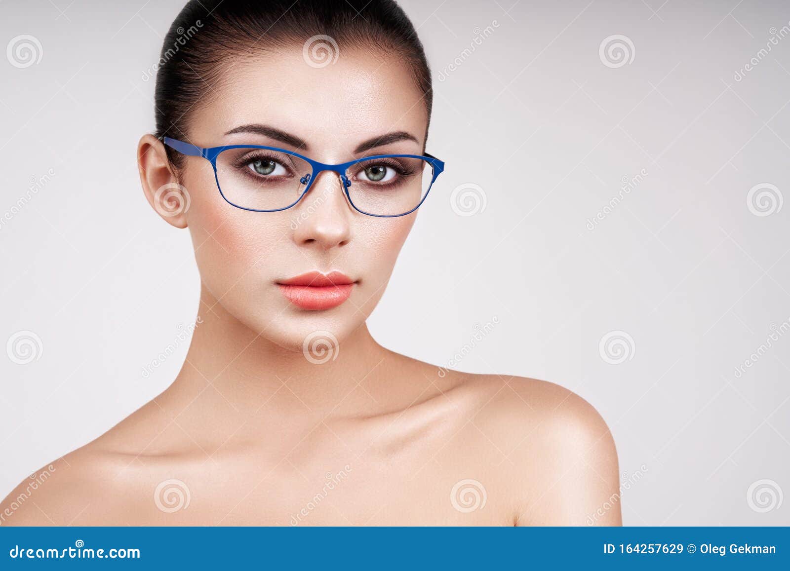 woman with long eyelashes in eyeglasses