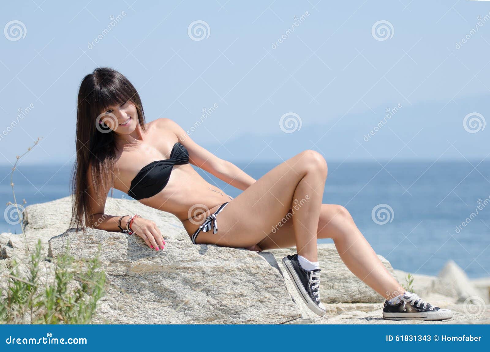 woman with long hair and prefect slim body in bikini