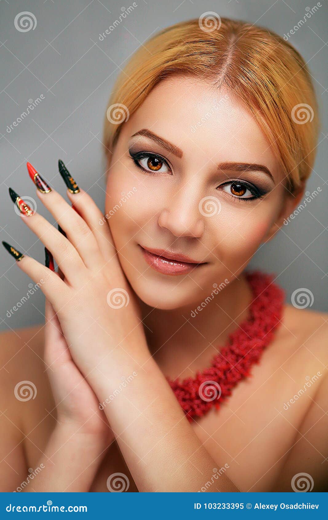 What do long nails say about a woman?