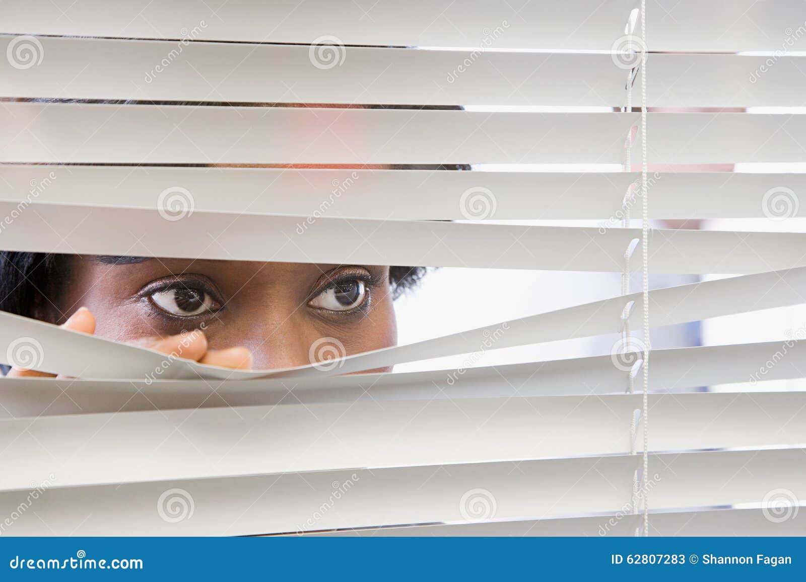 Woman Looking through Blinds Stock Image Image of adult, peeking