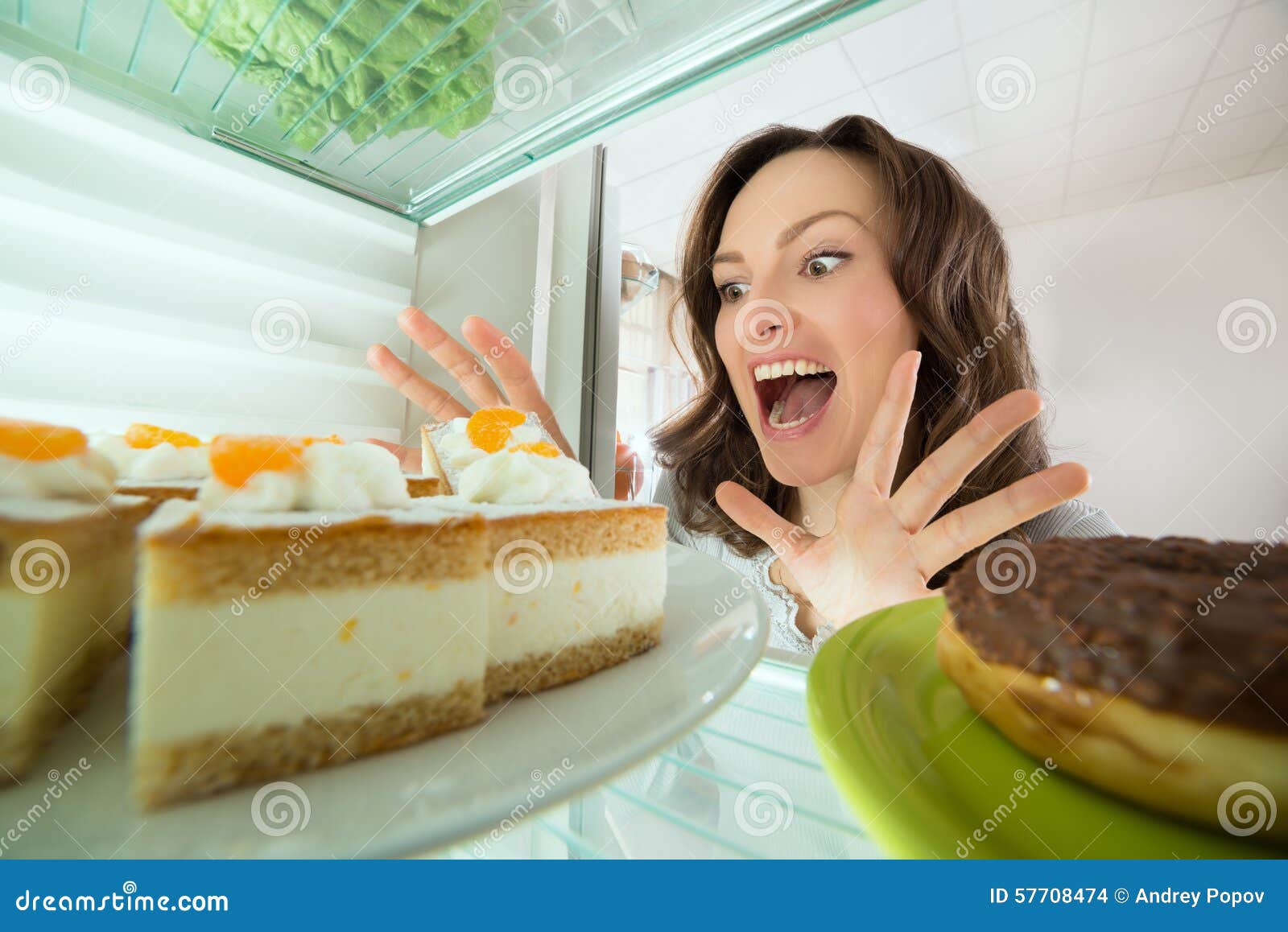 Woman Looking at Cake in Refrigerator Stock Photo Image of donut