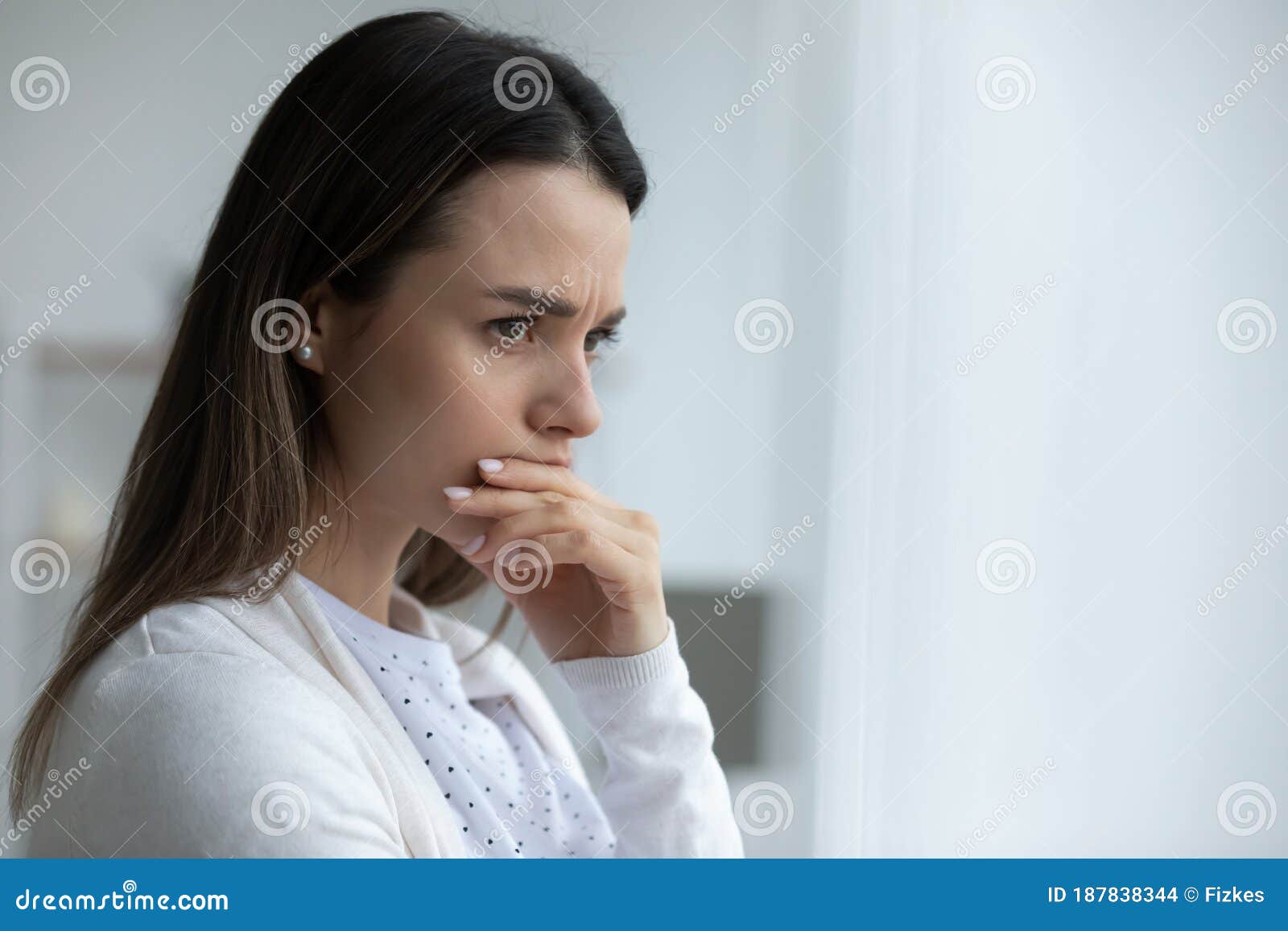 woman looking in distance feels upset having life troubles